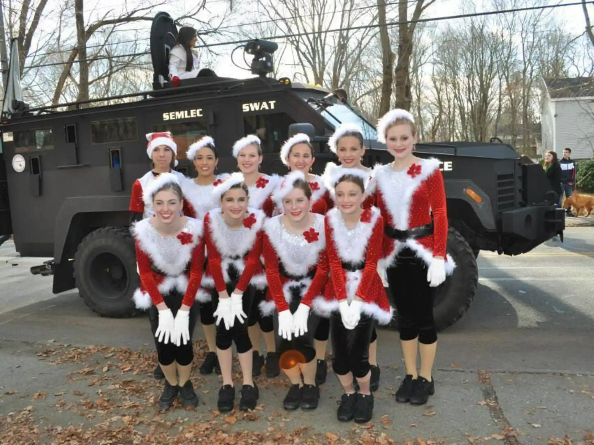 a group of people in santa clothing