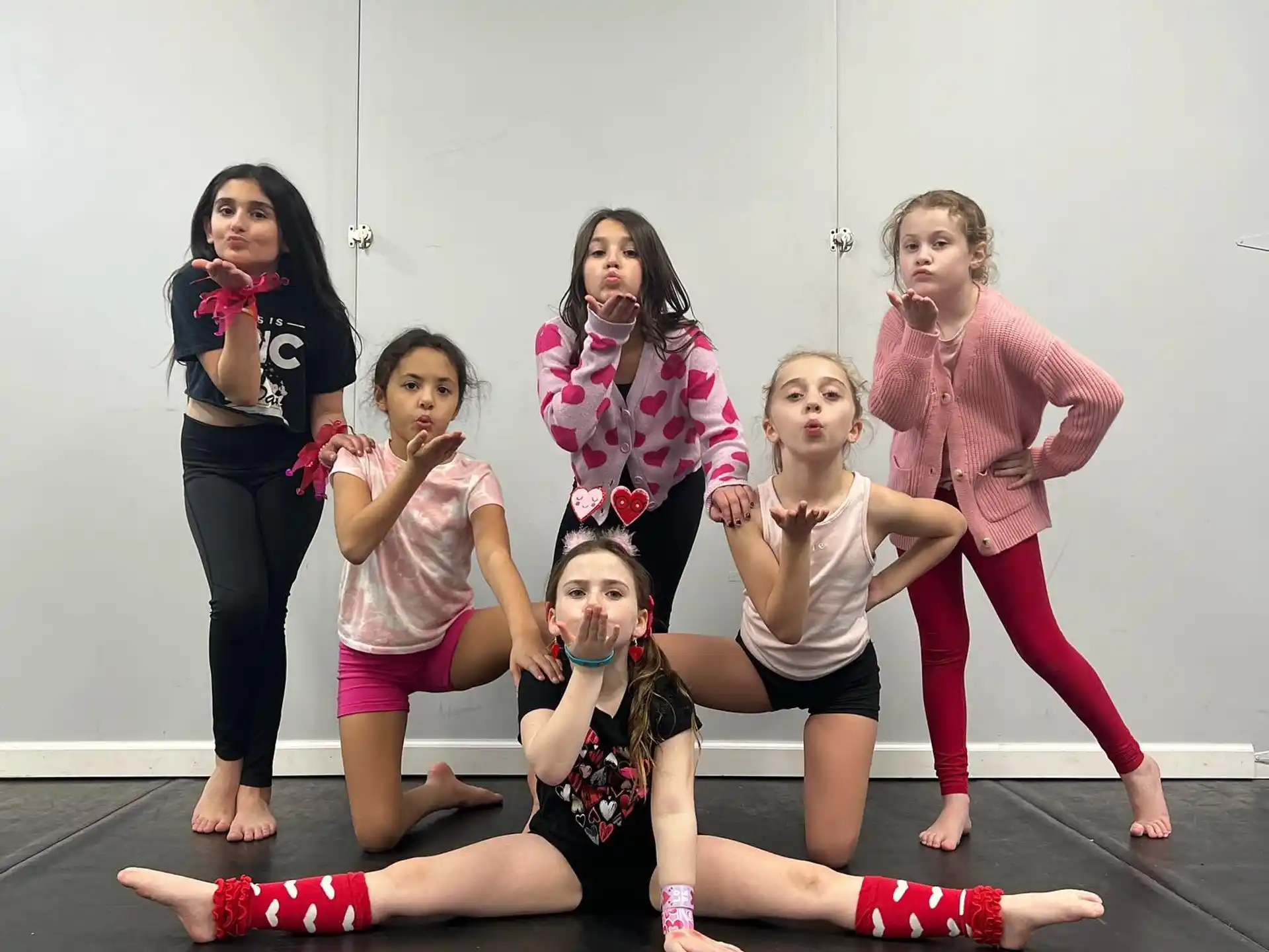 a group of girls posing for a photo