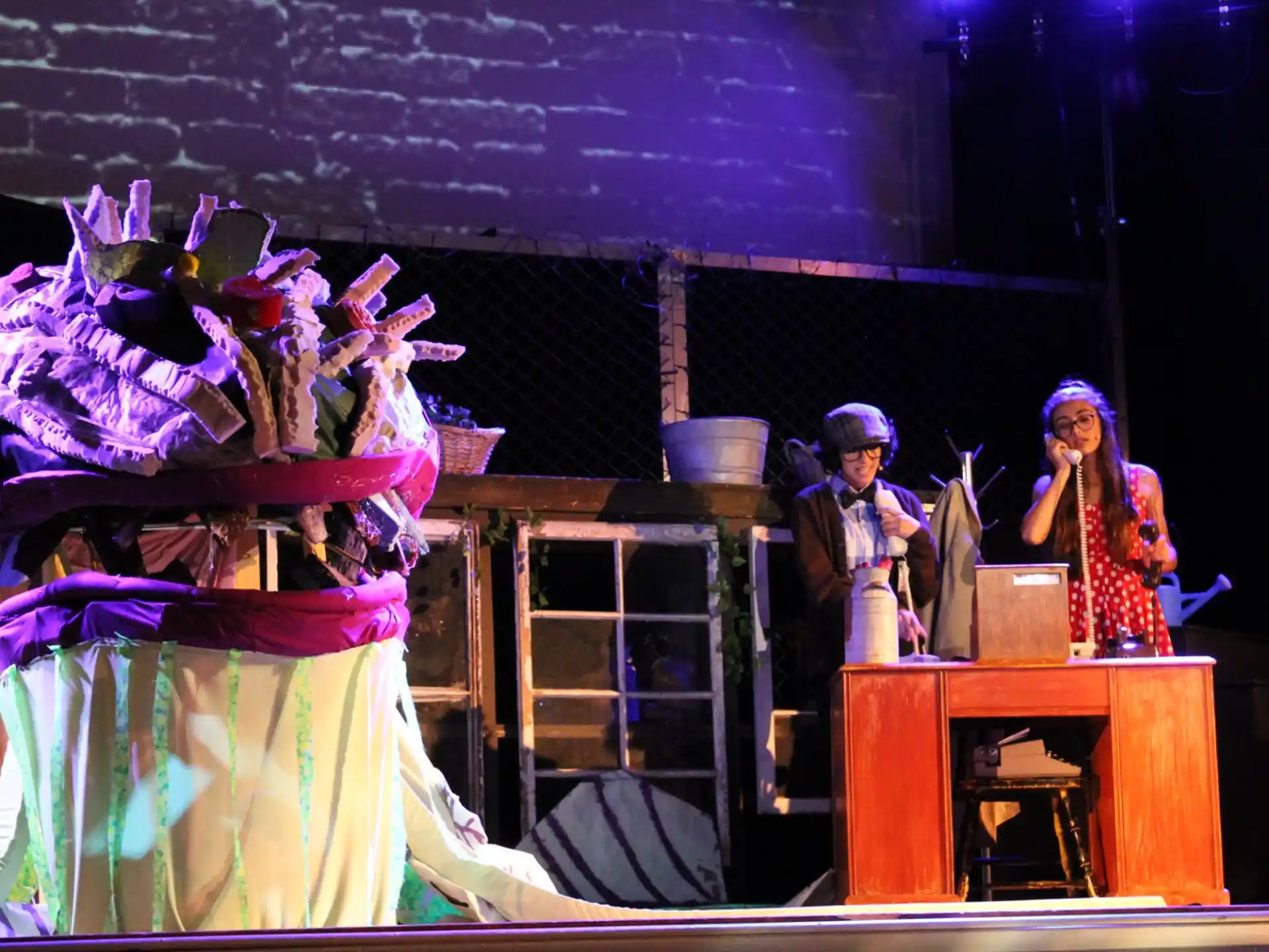 a man and woman on stage