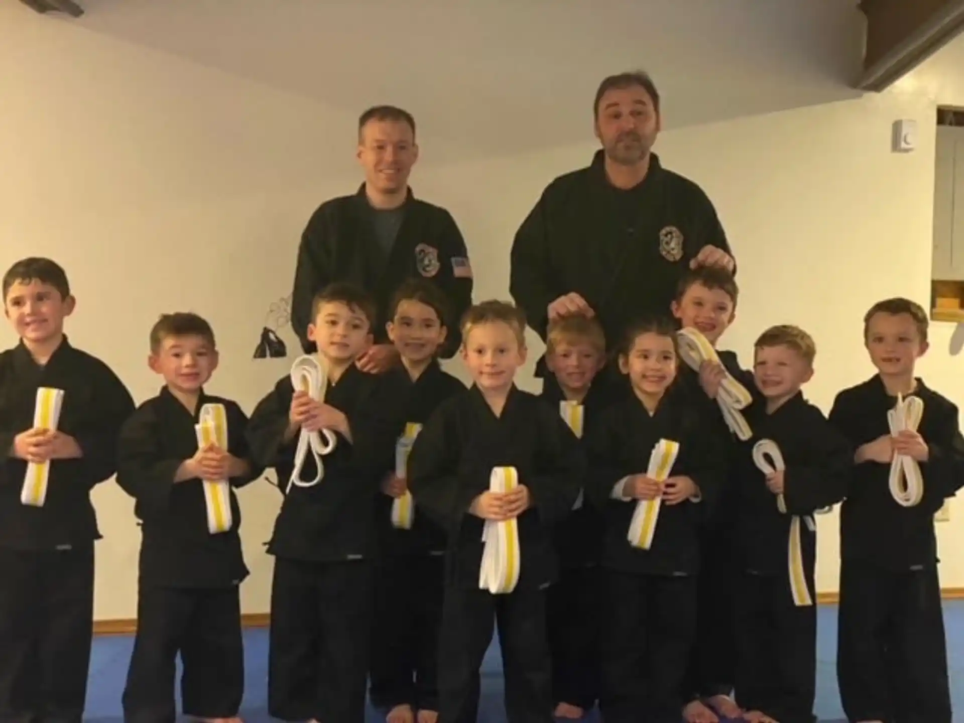 a group of people holding trophies