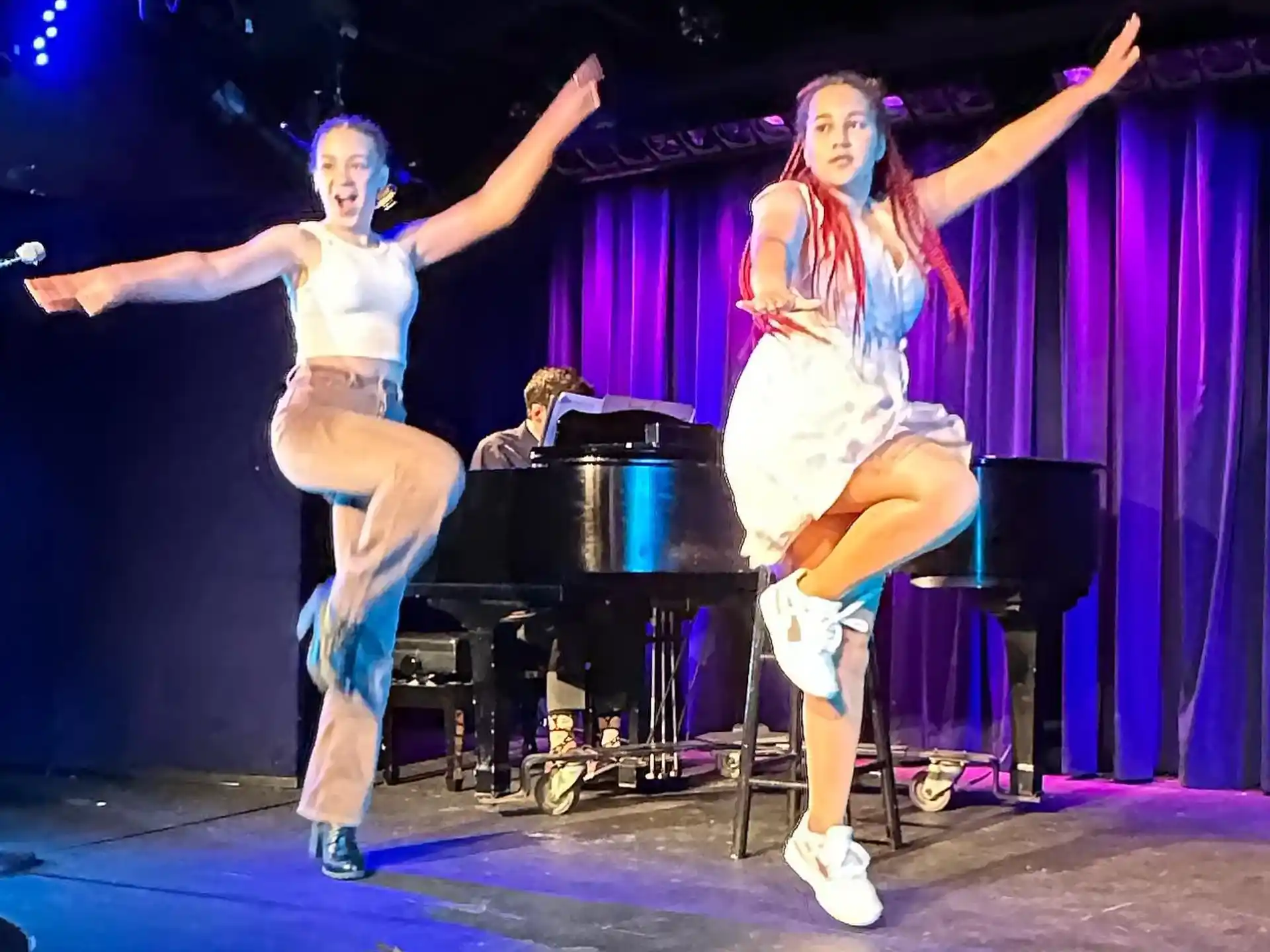 a couple of women on a stage