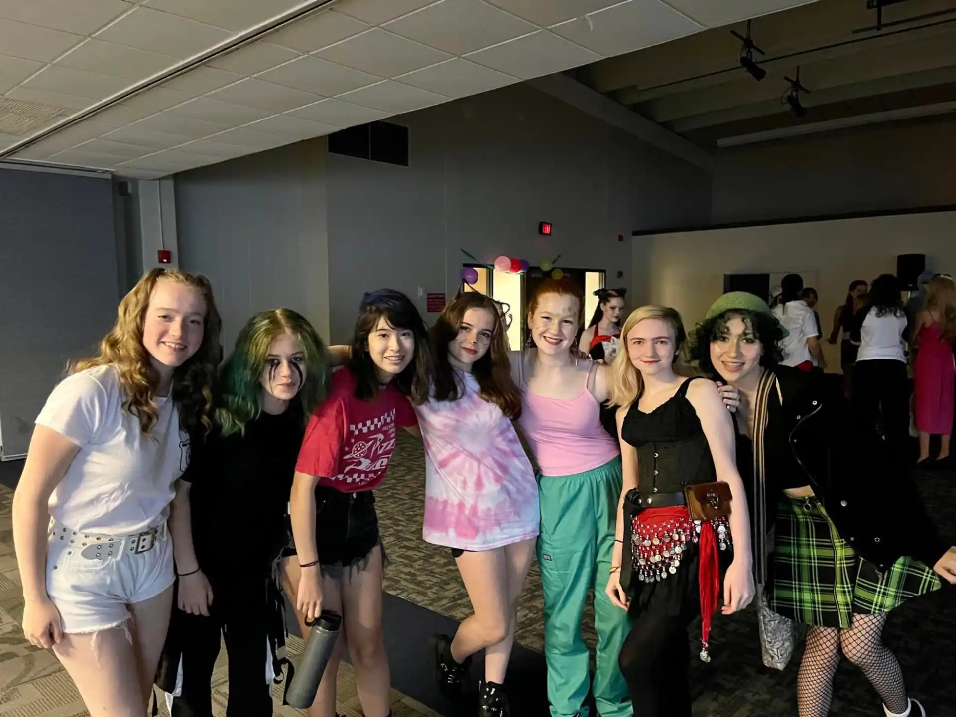 a group of women posing for a photo