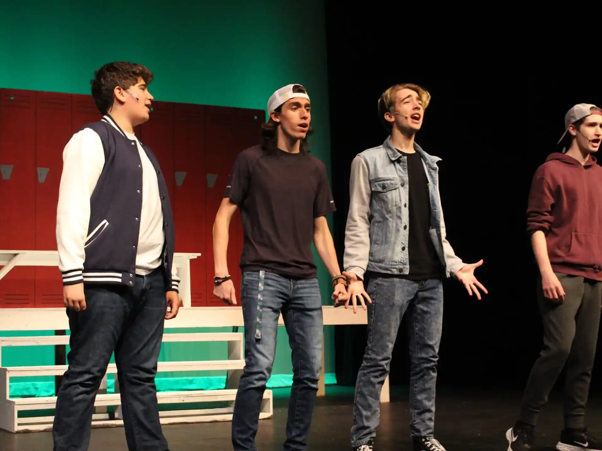 a group of men standing on a stage