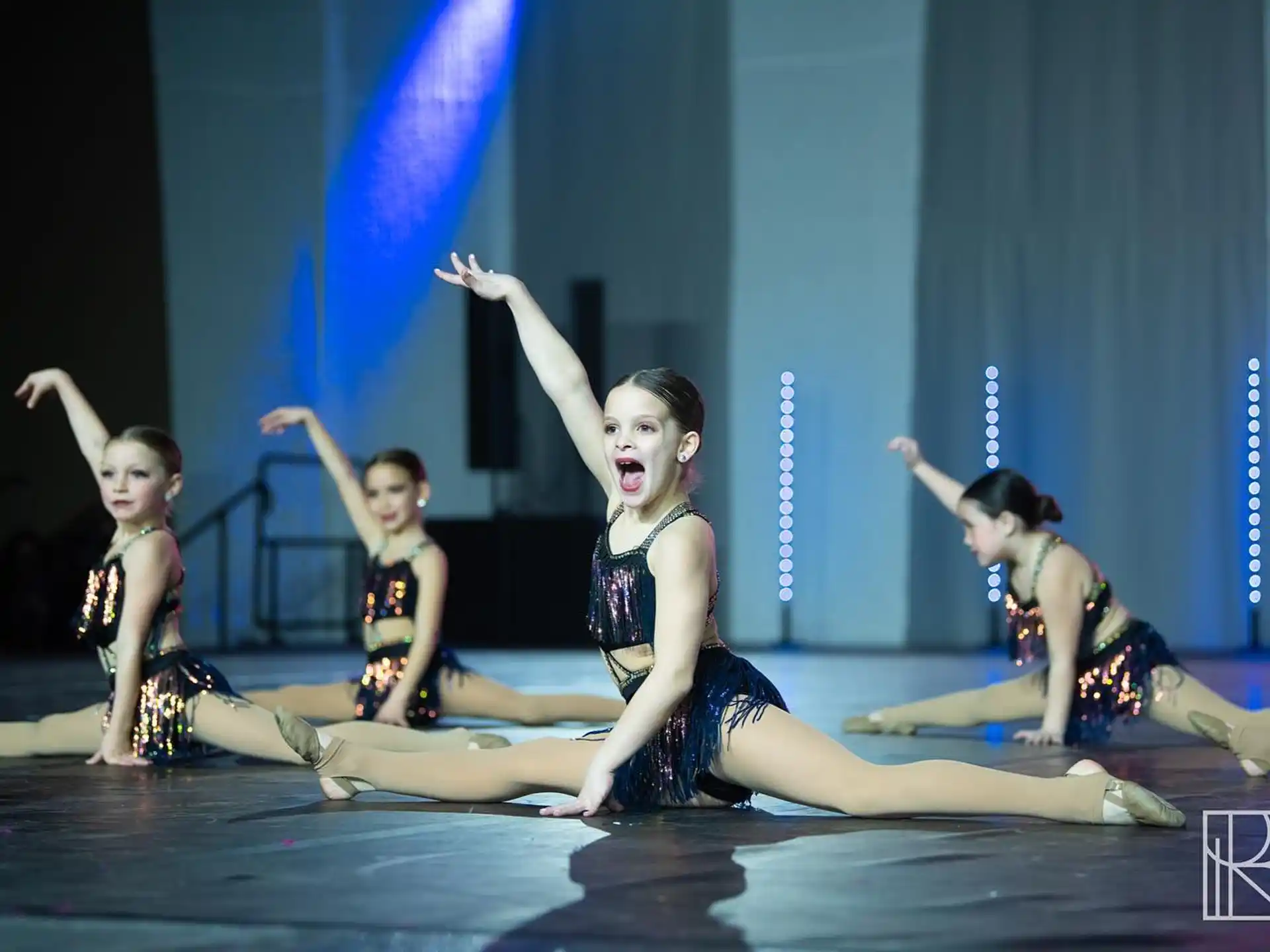 a group of women dancing on a stage