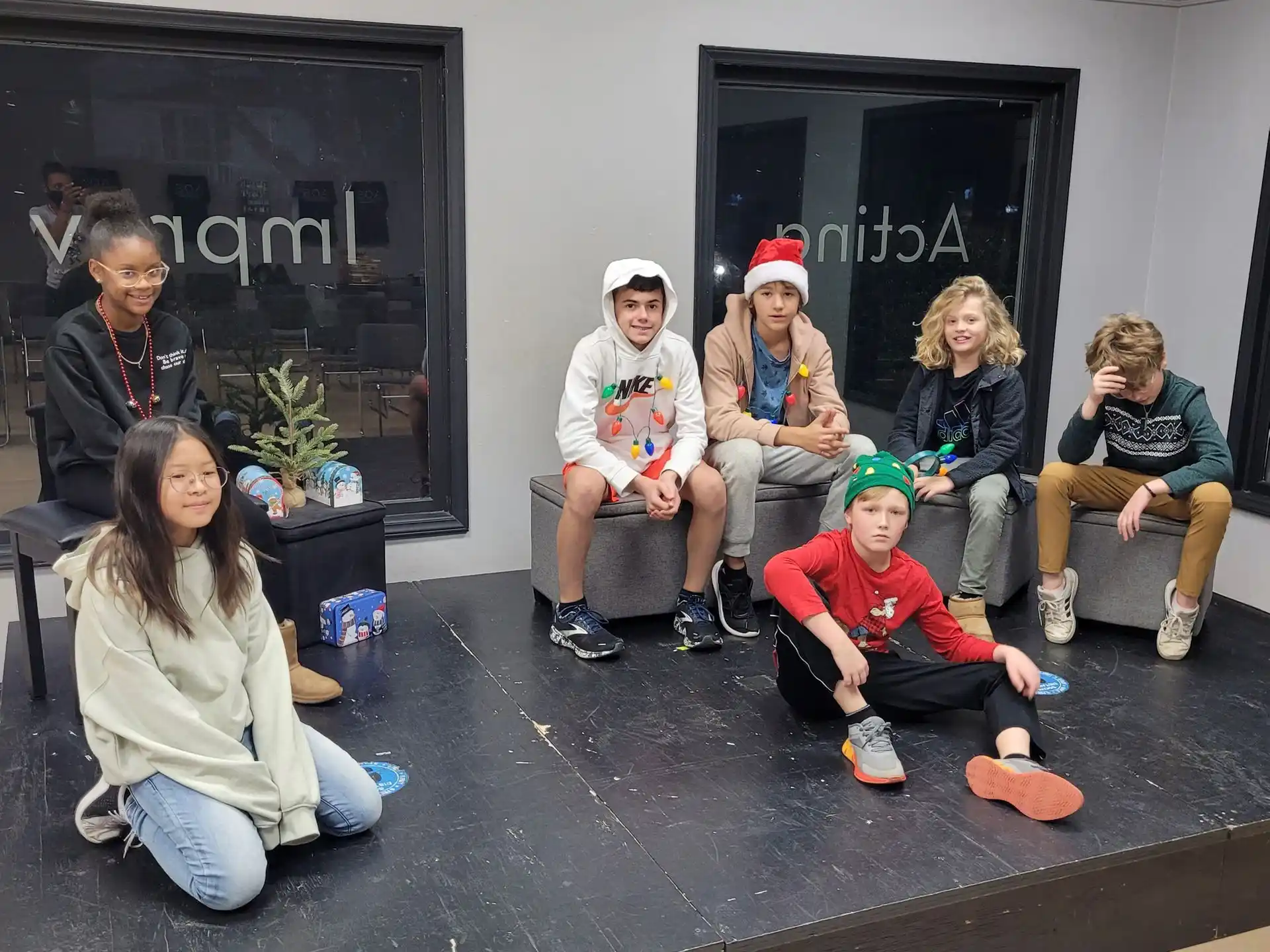 a group of people sitting on a porch
