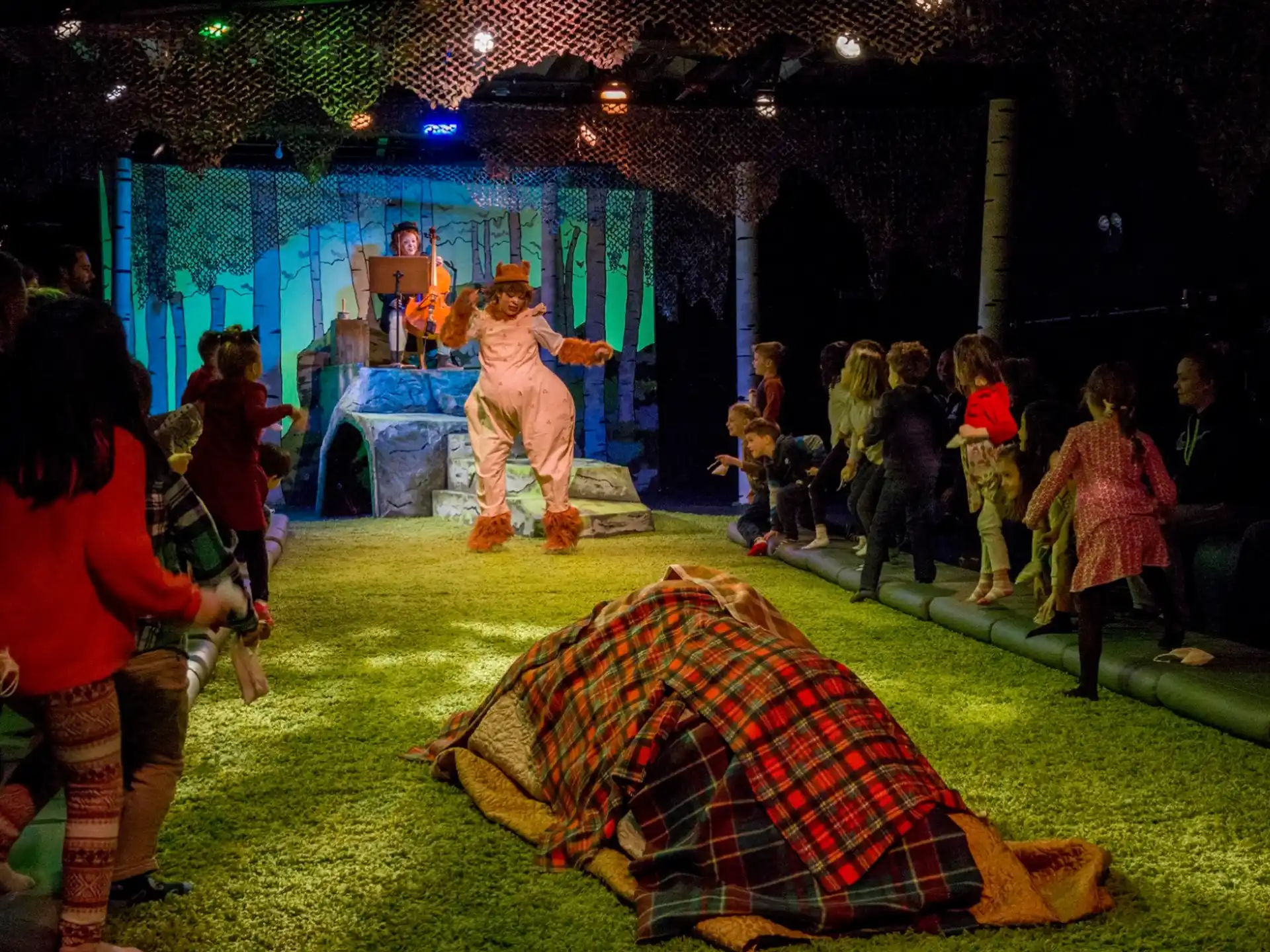 a group of people dancing on a stage