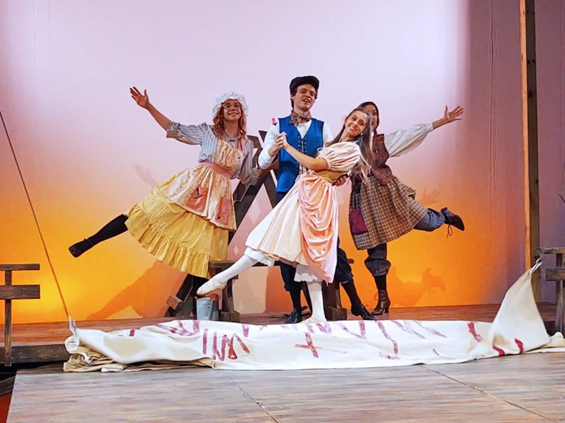 a group of people dancing on a stage