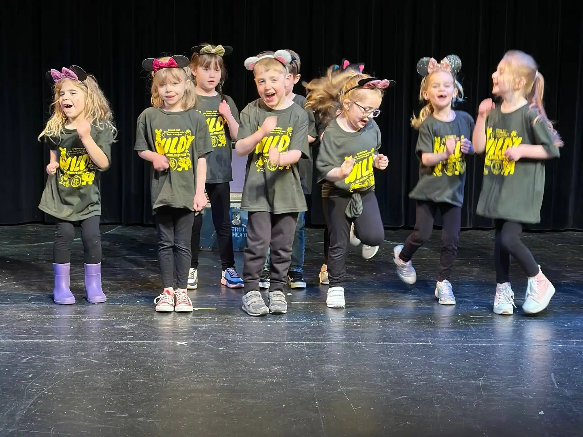 a group of children in matching outfits