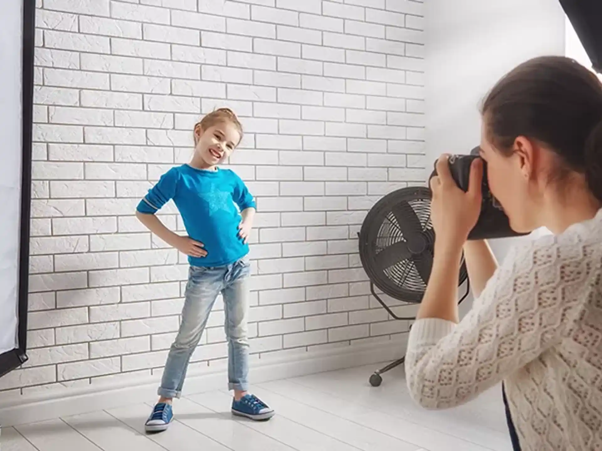 a child standing in front of a woman