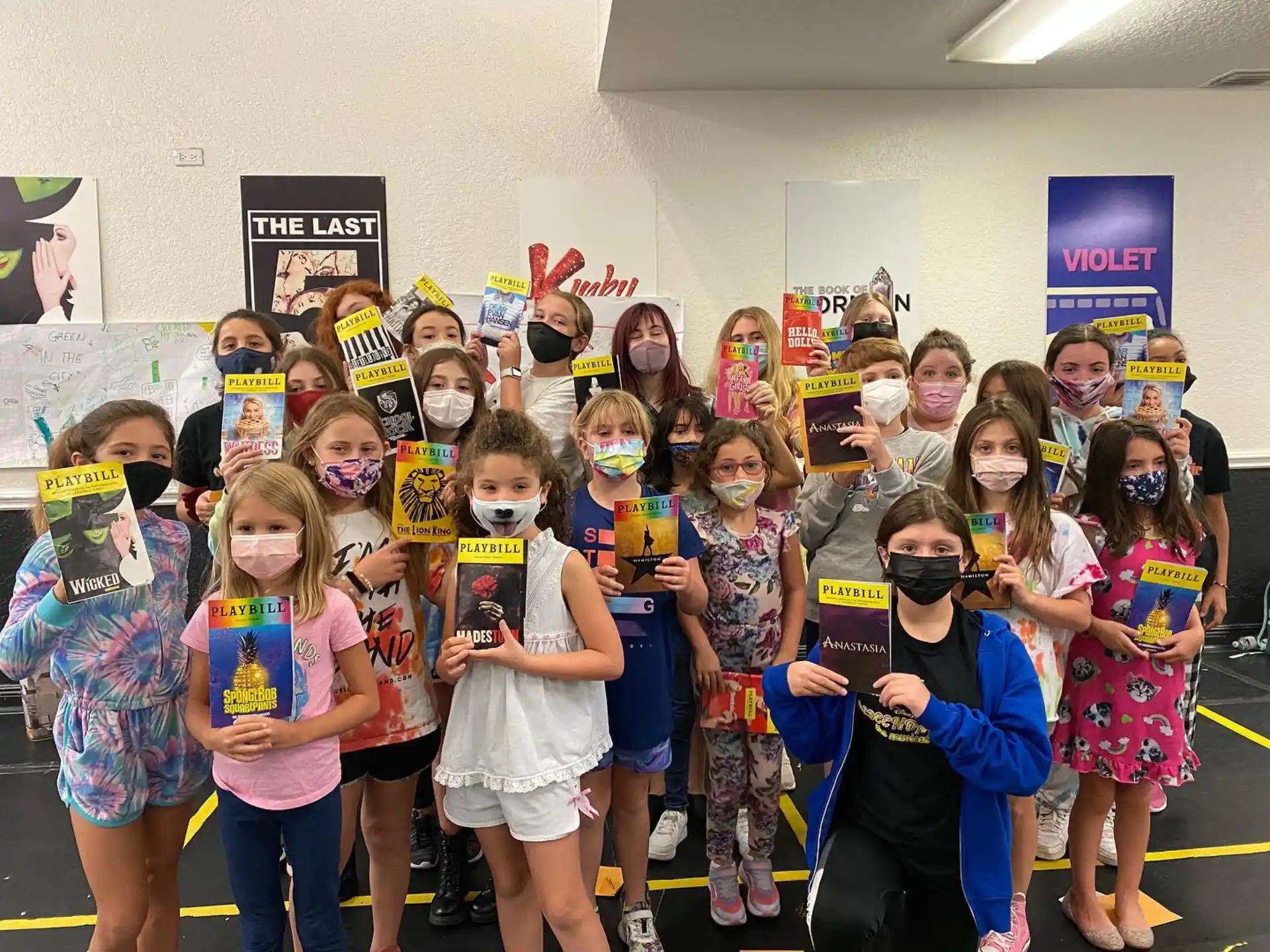 a group of children wearing masks