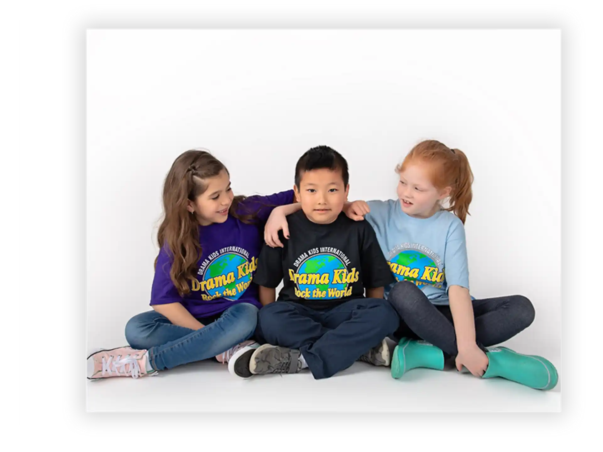 a group of children sitting on the ground