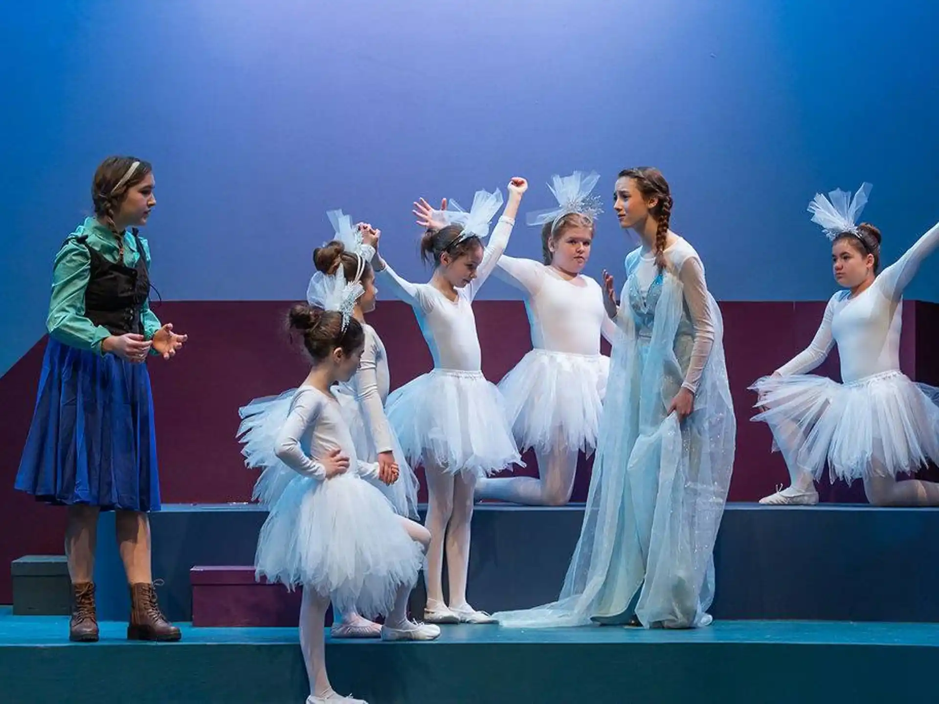 a group of women dancing on a stage