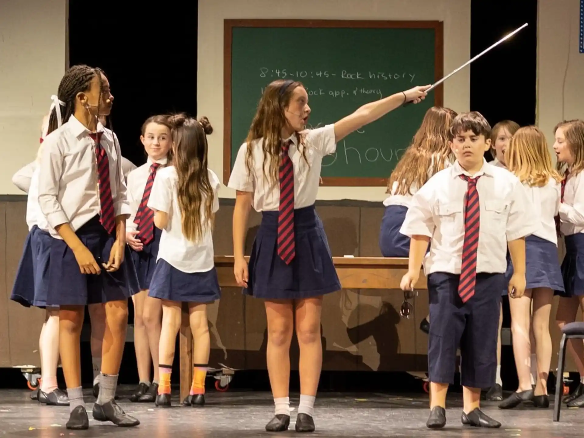 a group of children in school uniforms