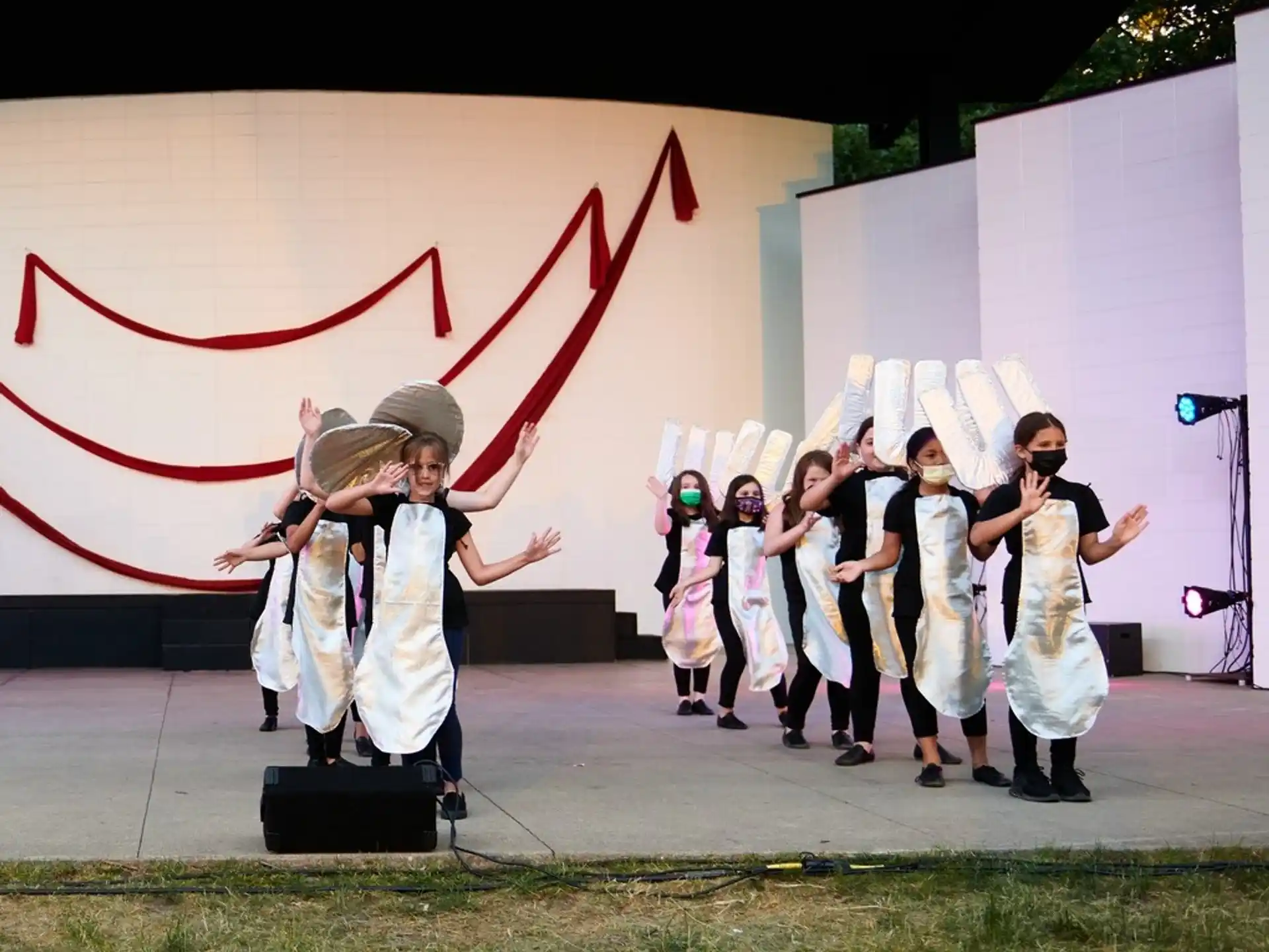 a group of people in white robes holding a flag