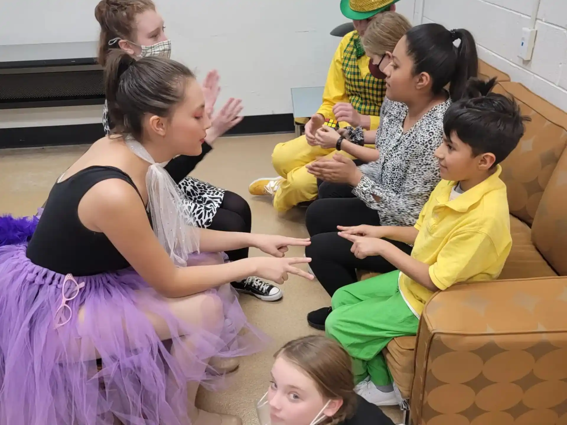 a group of people sitting on the floor