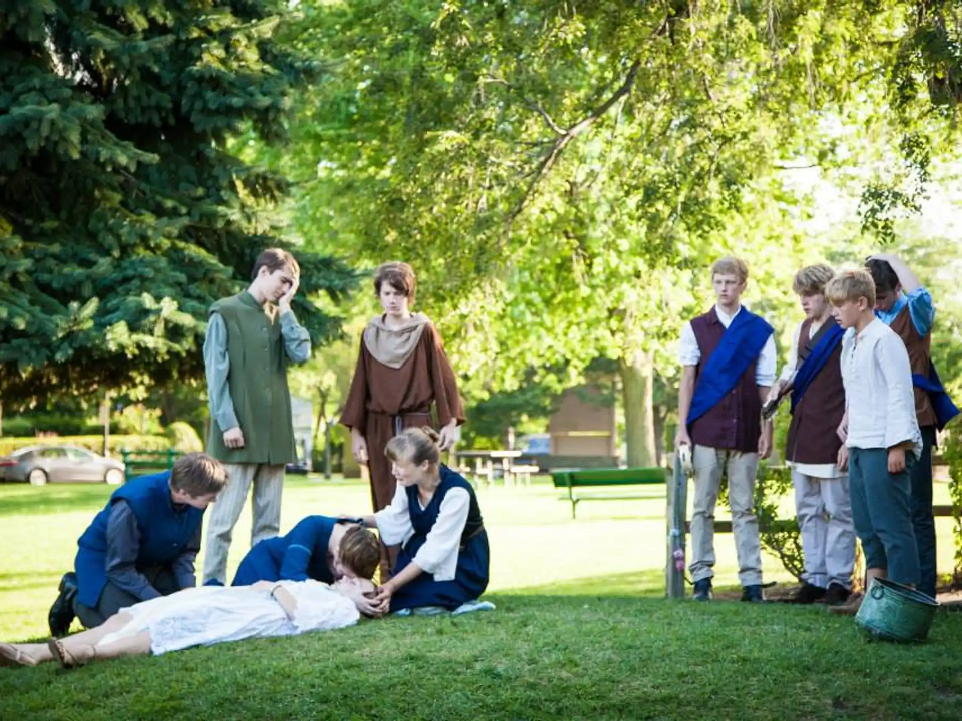 a group of people standing on grass