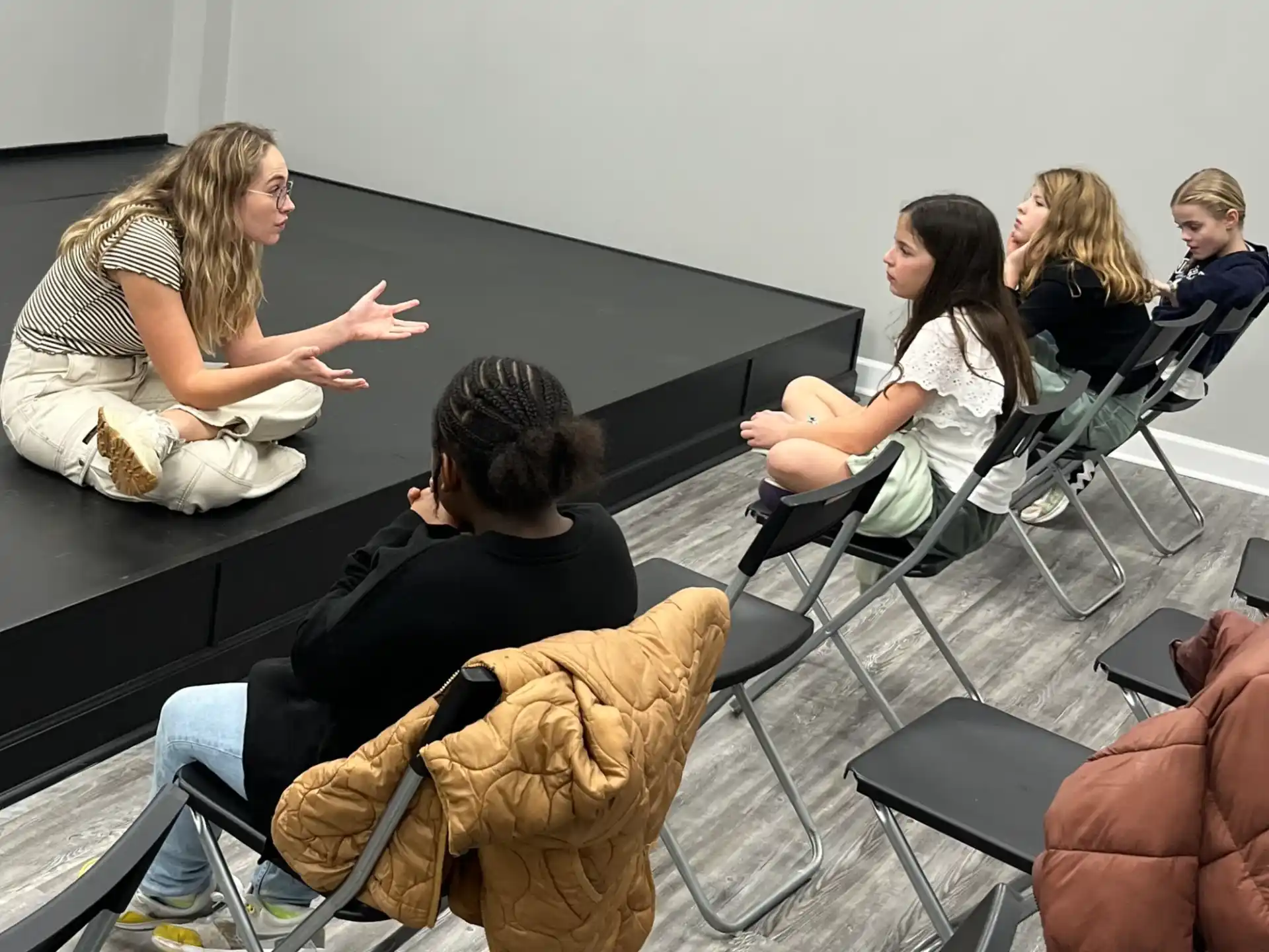 a group of people sitting in chairs