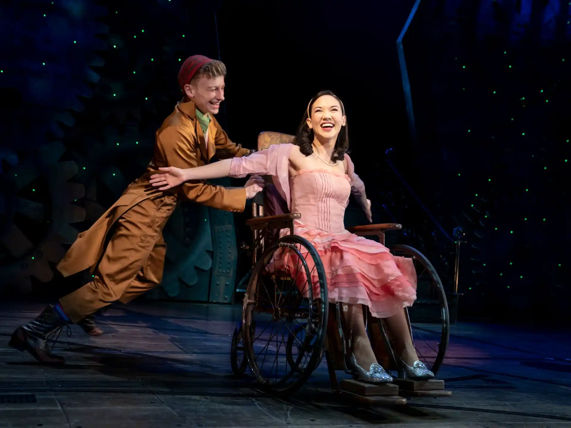 a man and woman on a wheelchair