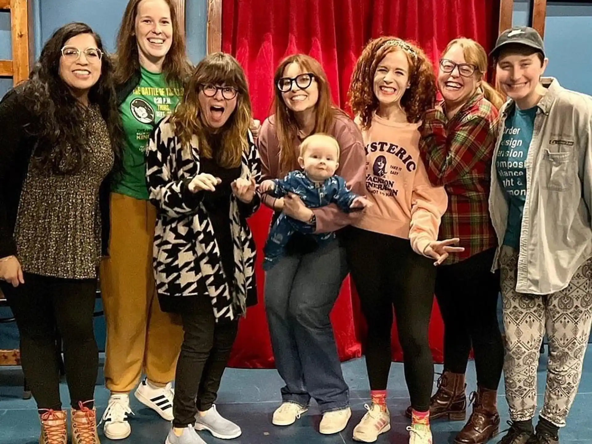 a group of people posing for a photo
