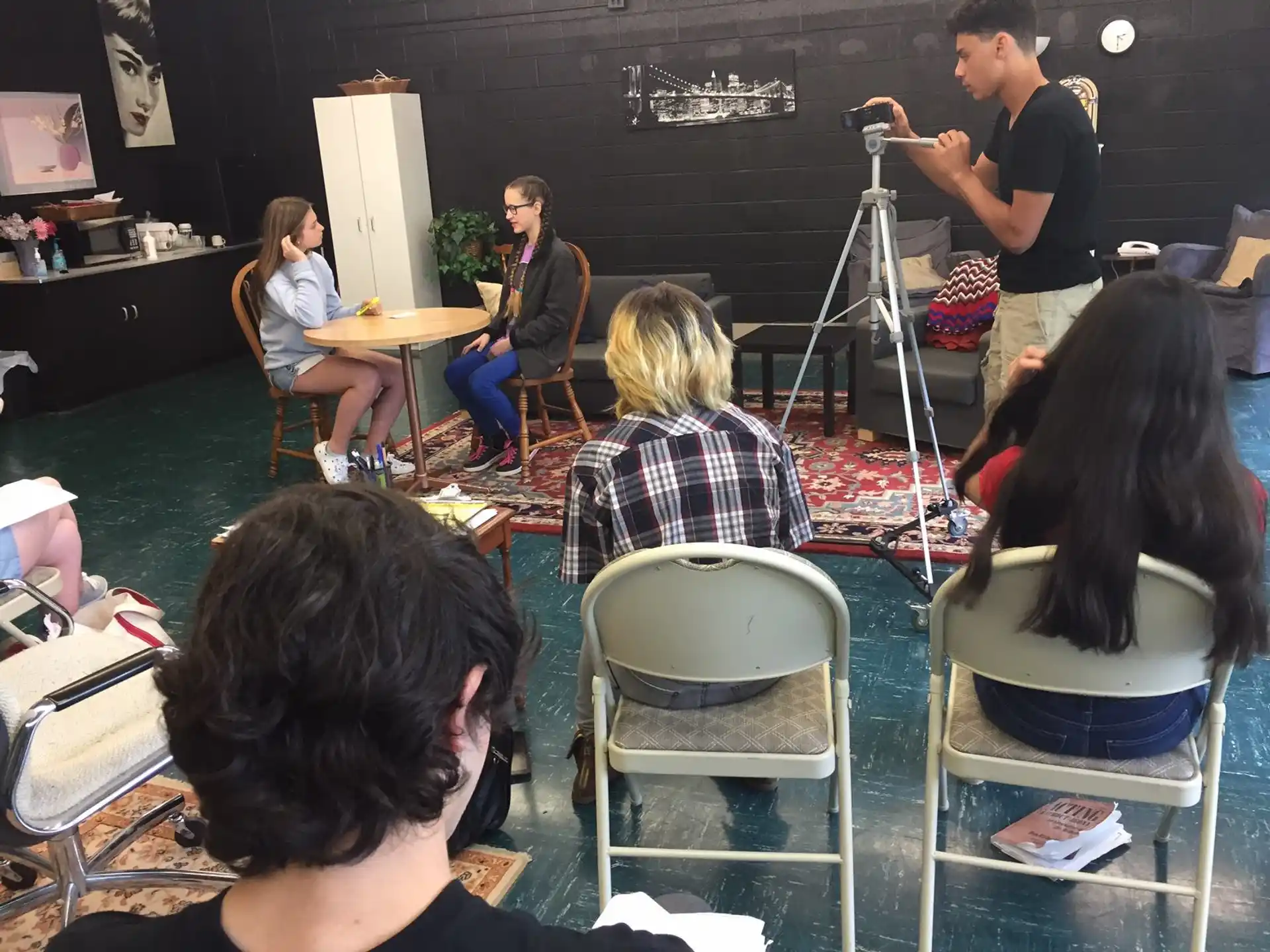 a group of people sitting in chairs