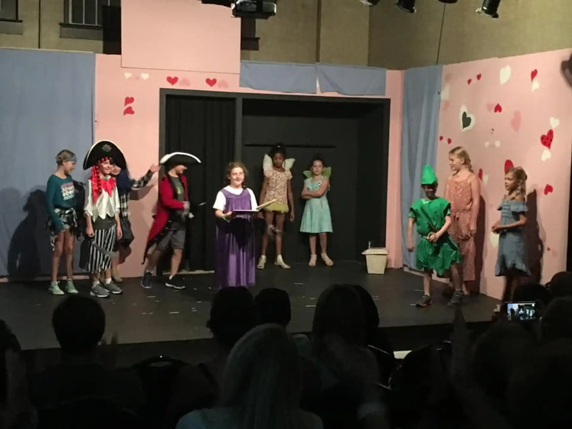 a group of children performing on a stage