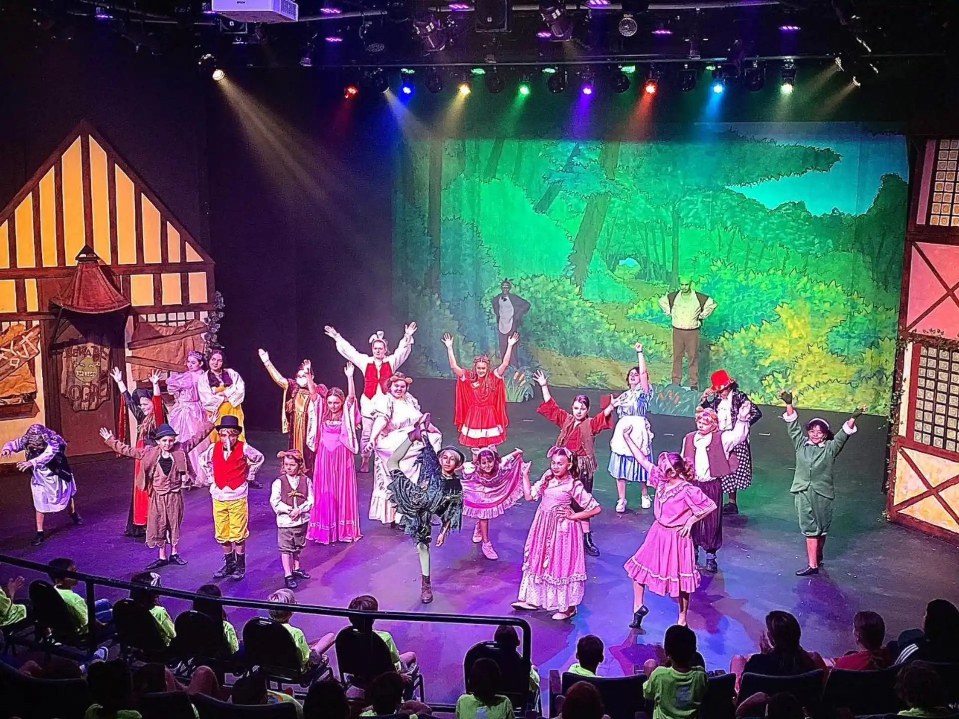 a group of people performing on a stage