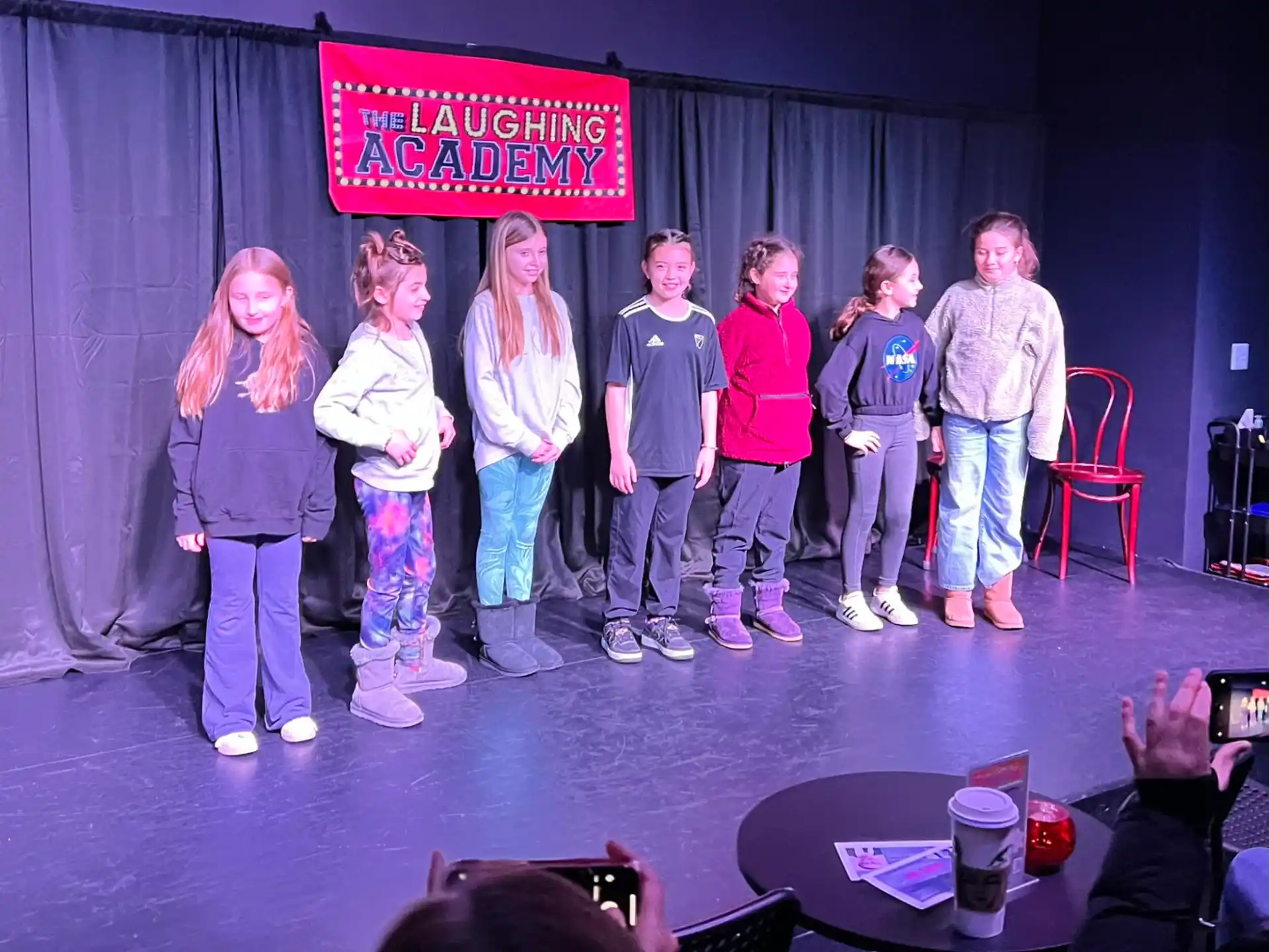 a group of people standing on a stage