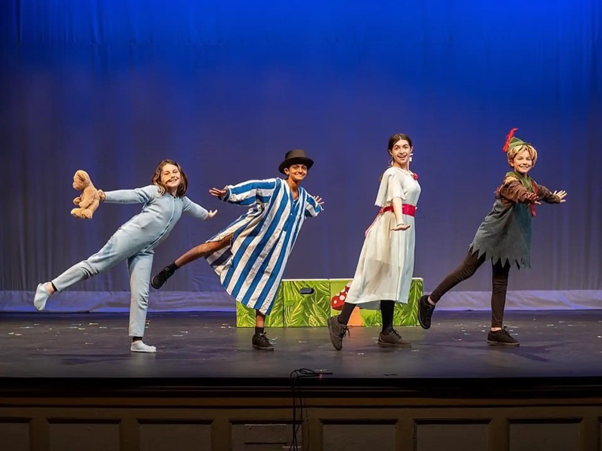 a group of people dancing on a stage