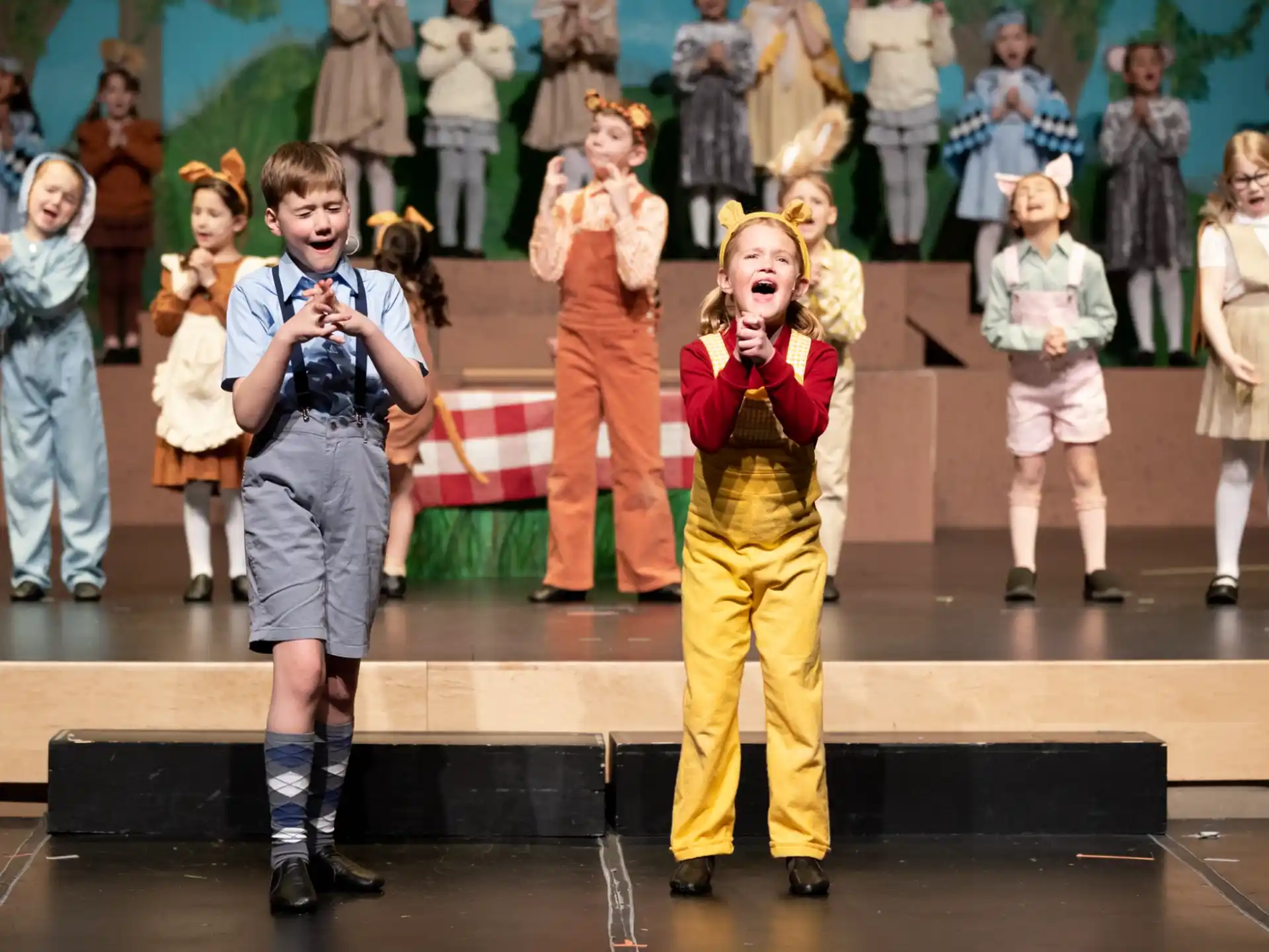 a group of children on a stage