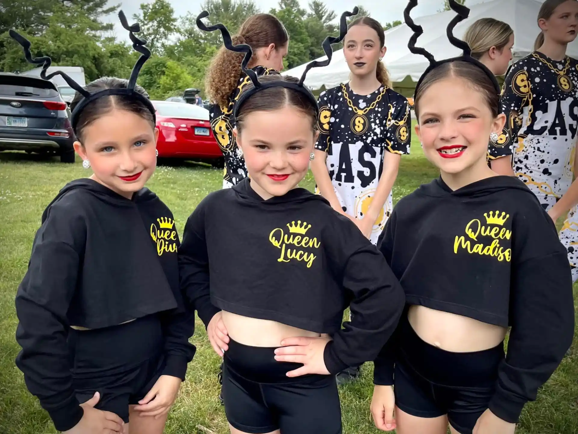 a group of girls in black shirts