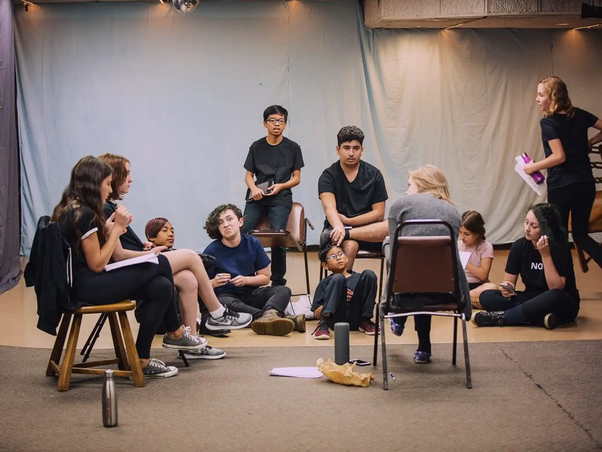 a group of people sitting in chairs