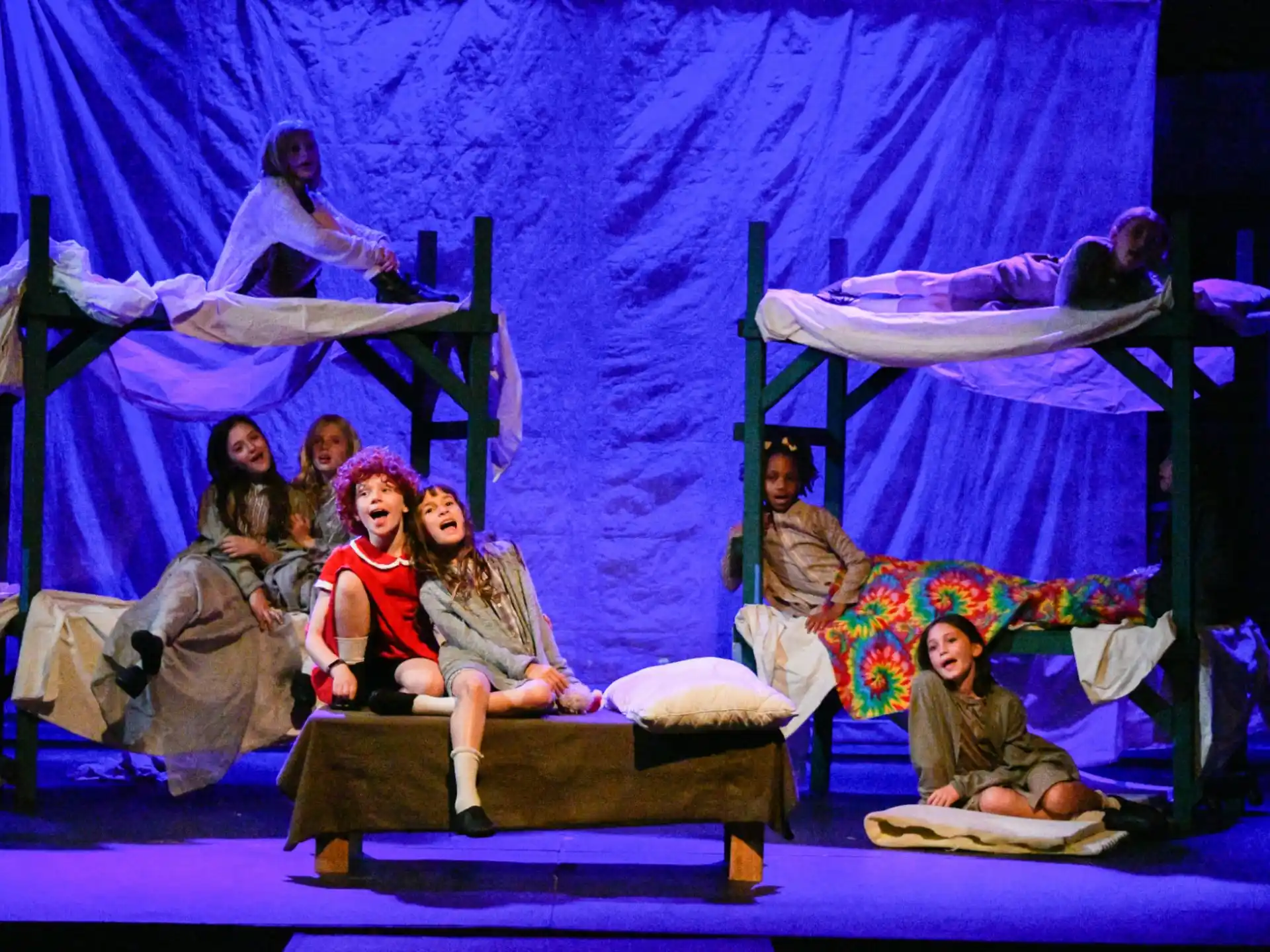 a group of people sitting on a stage