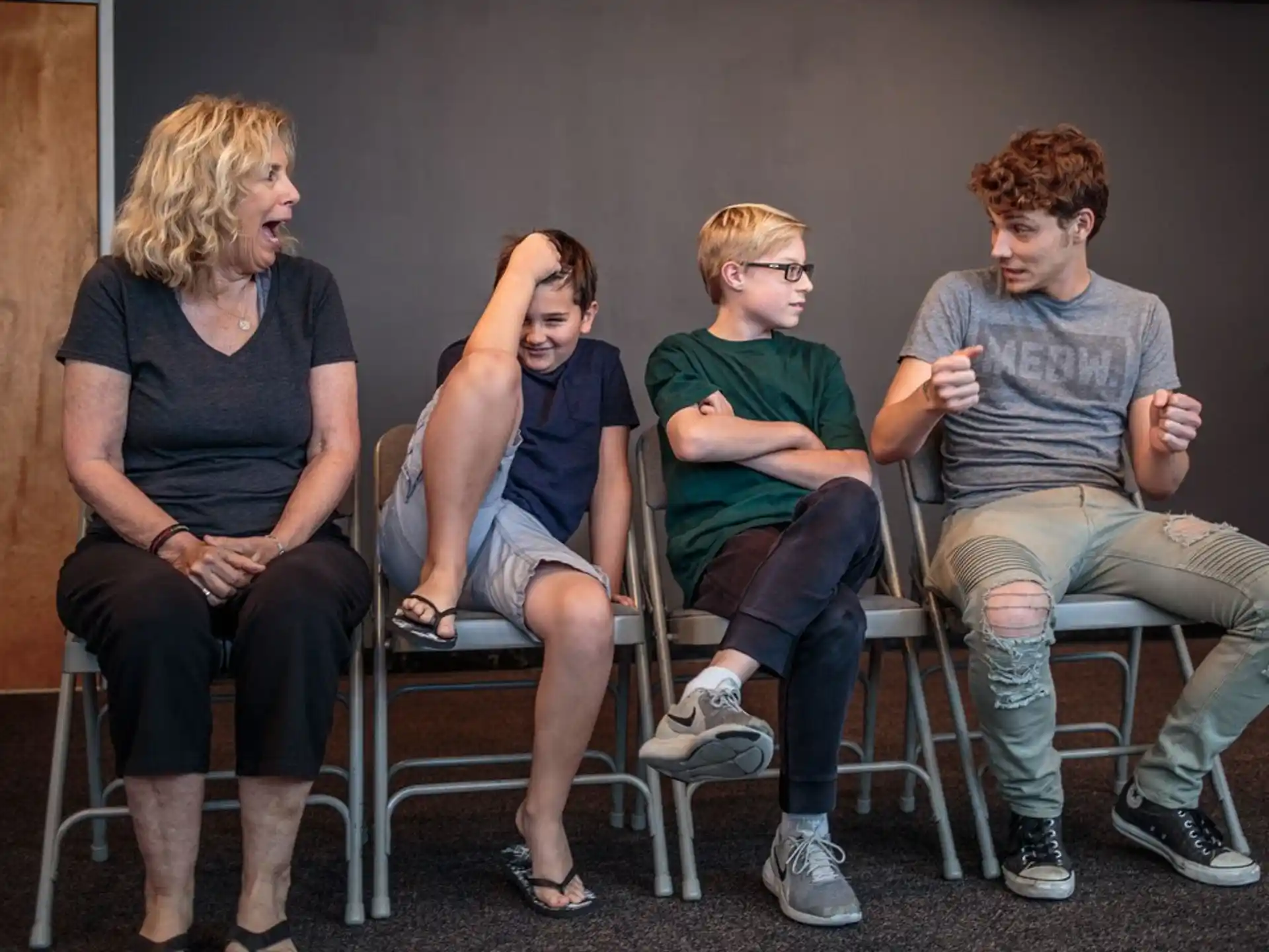 a group of people sitting in chairs