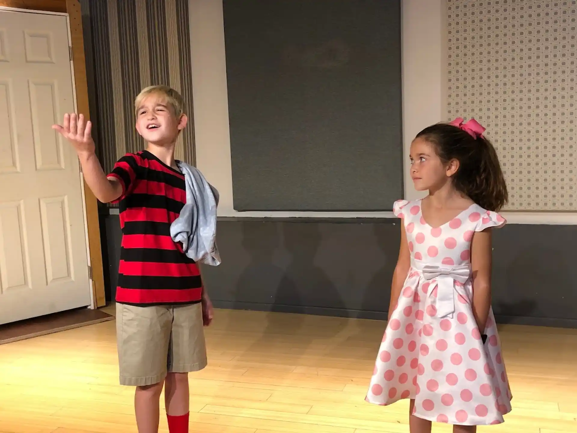 a boy and girl dancing