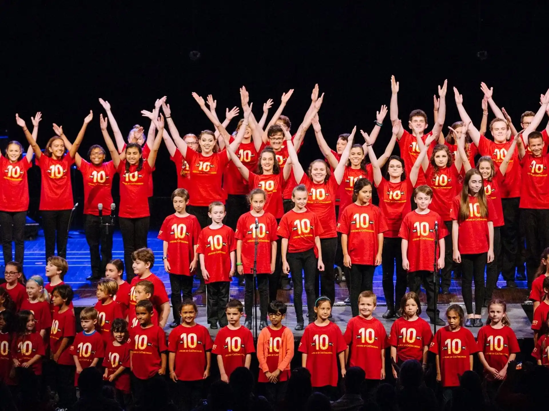 a group of people in red uniforms
