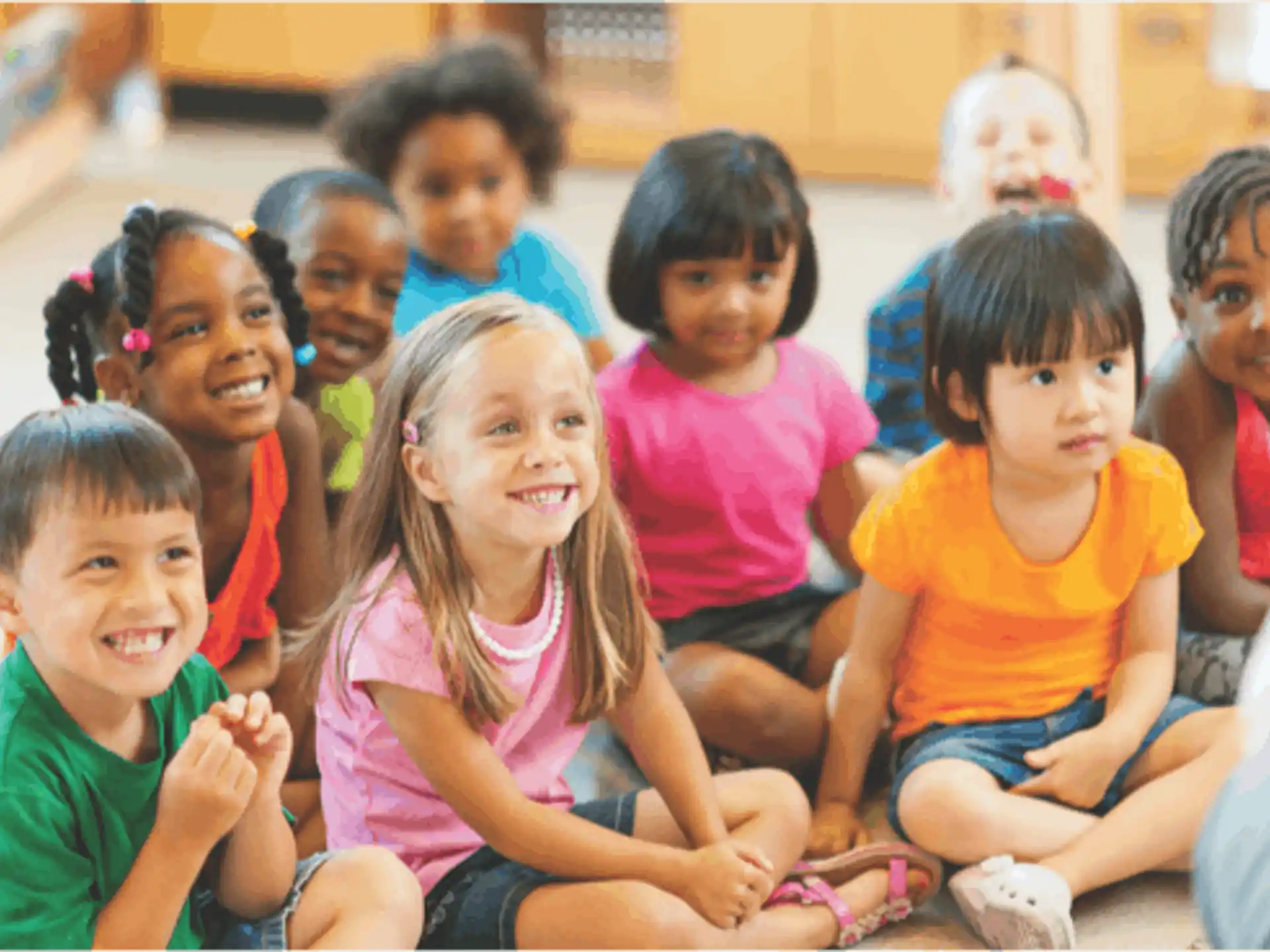 a group of children sitting on the floor