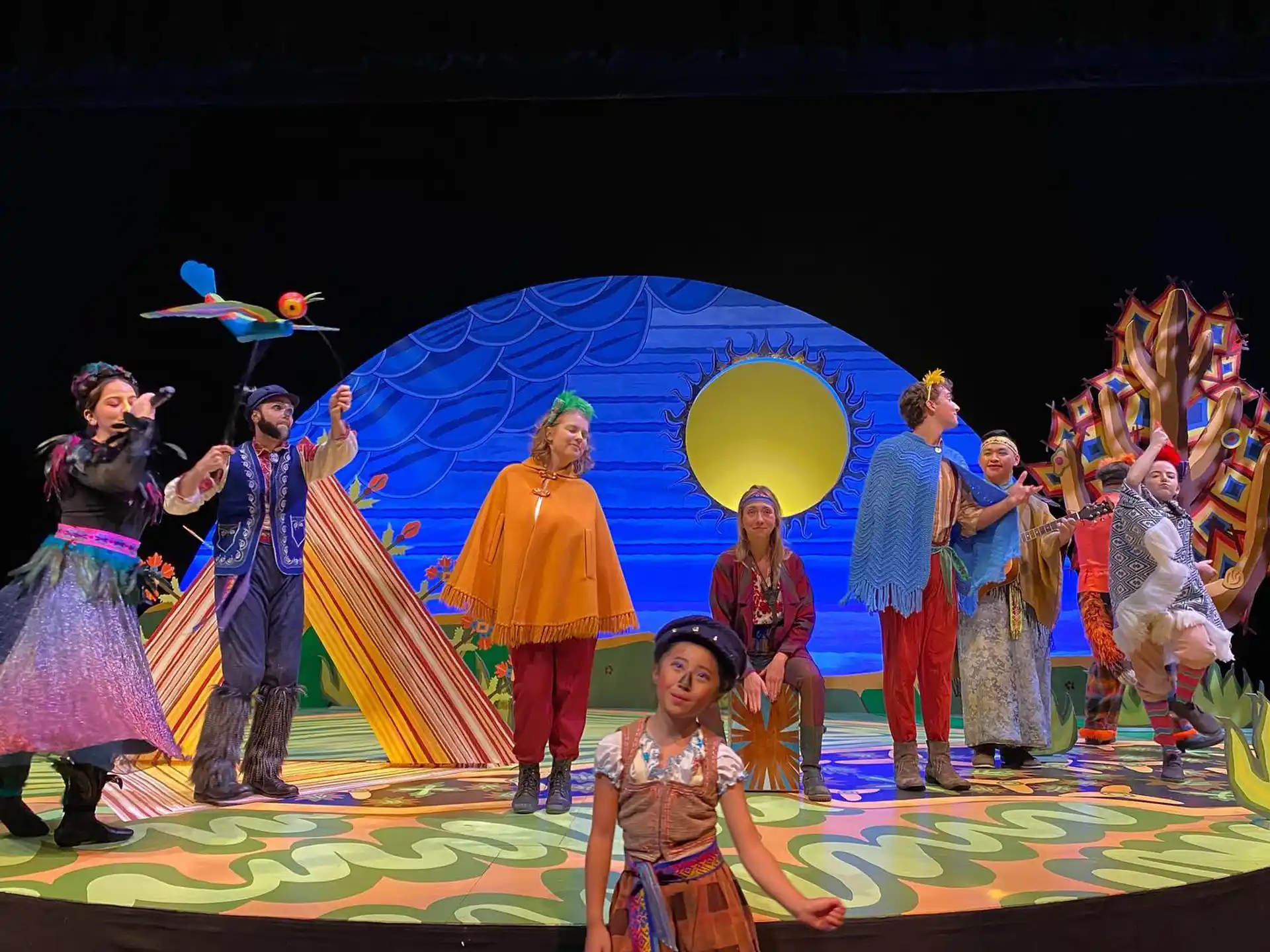 a group of people dancing on a stage