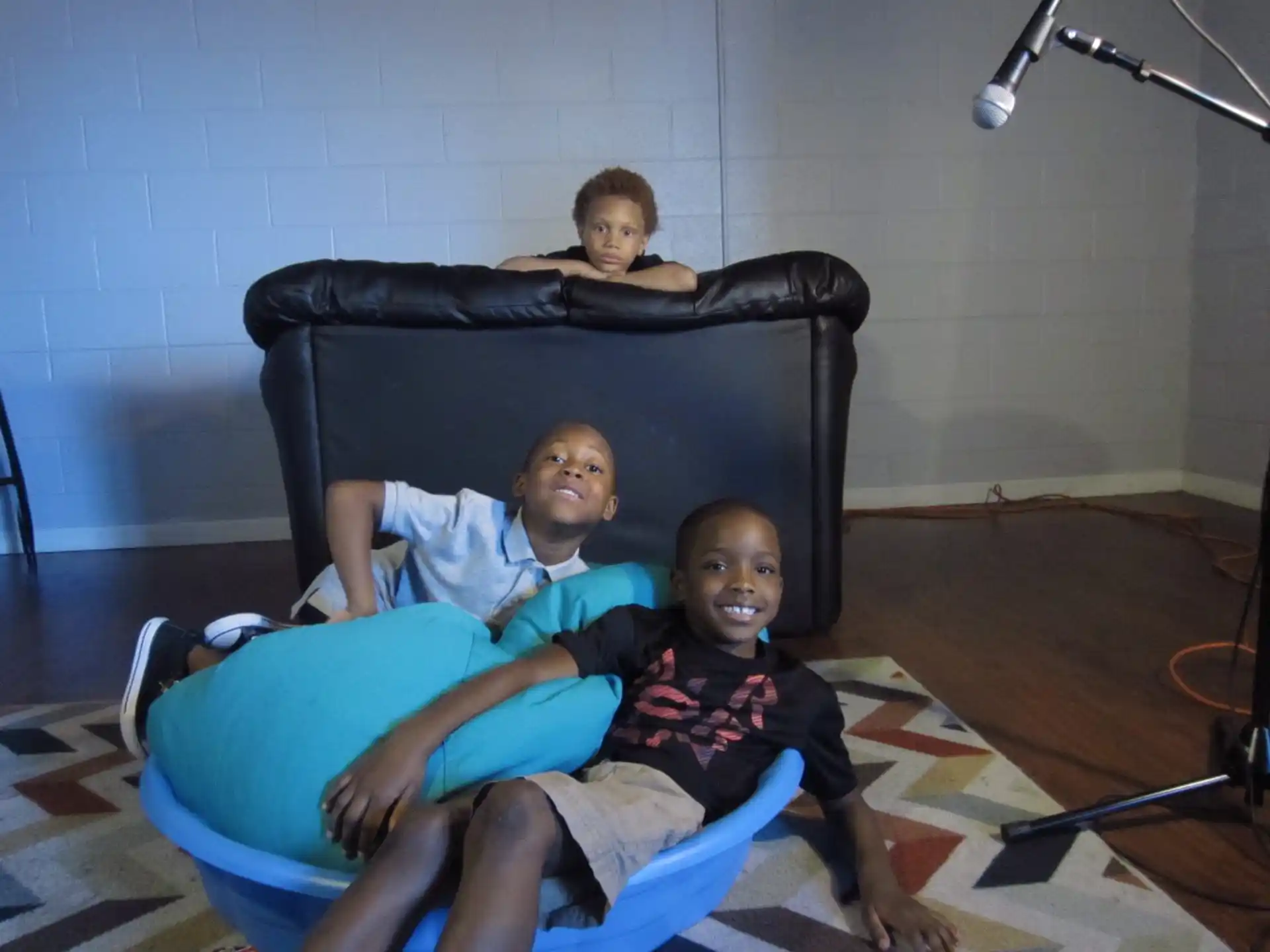a group of boys sitting on a couch