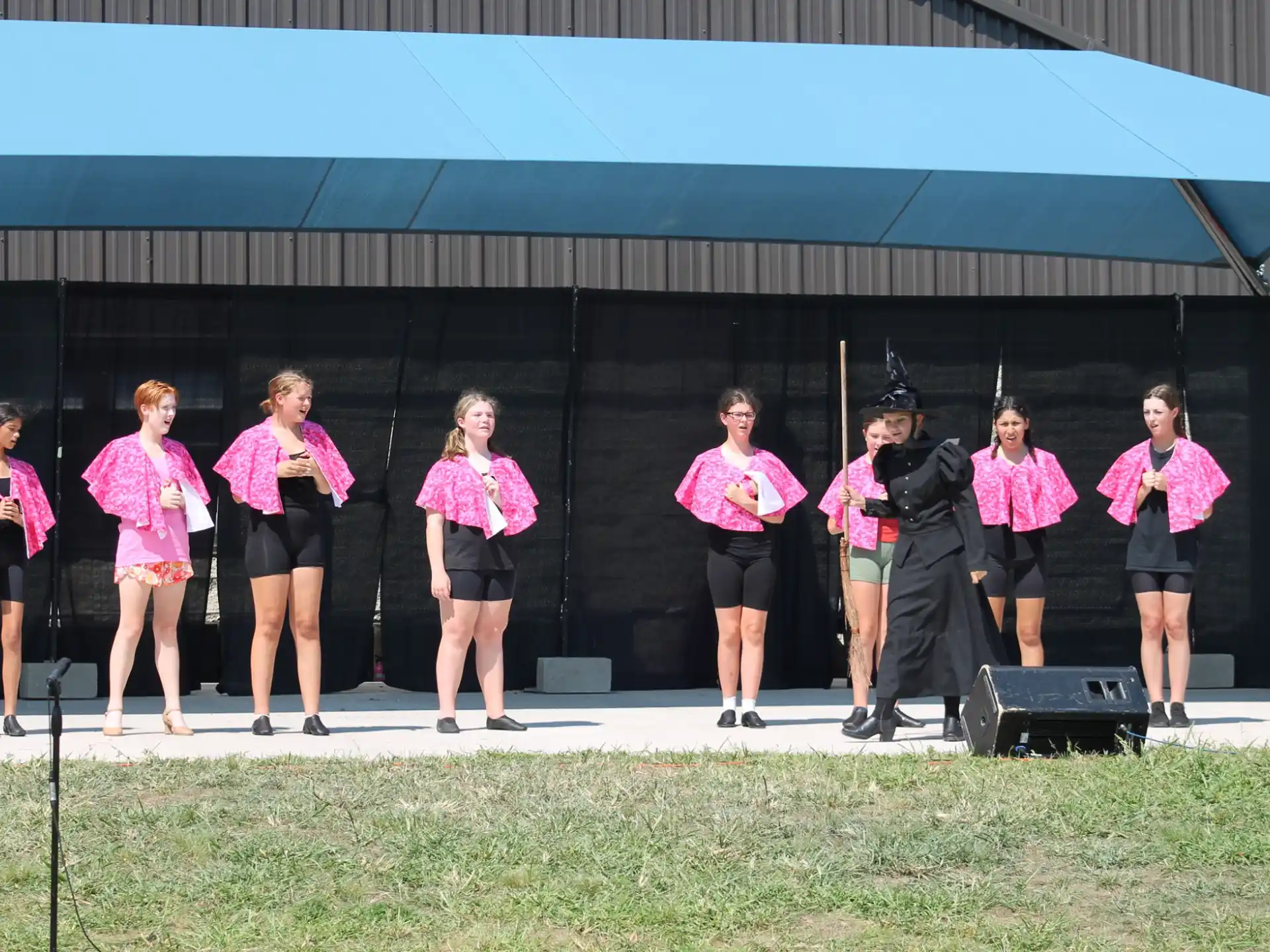 a group of women wearing matching outfits