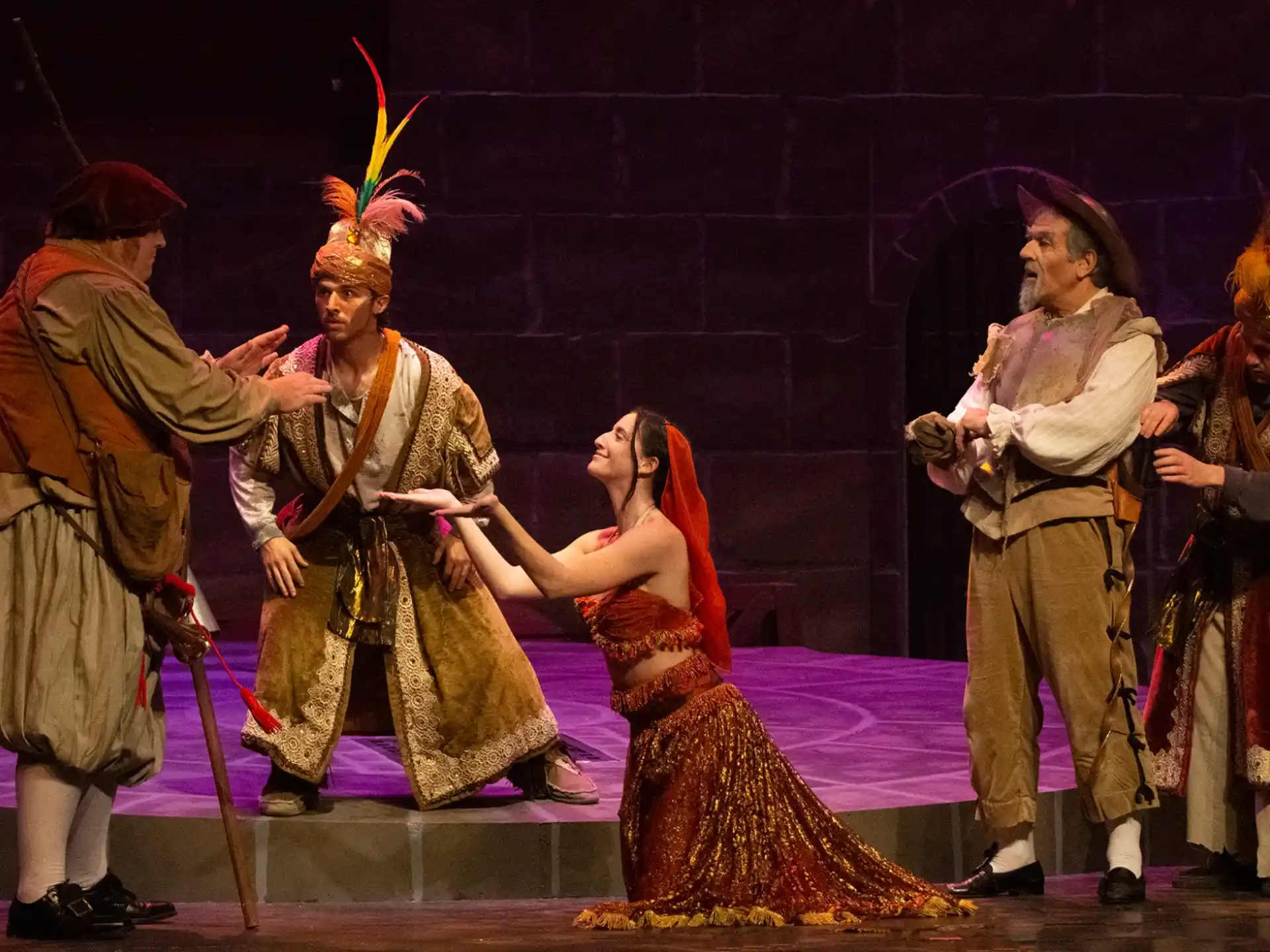 a group of people in clothing on a stage