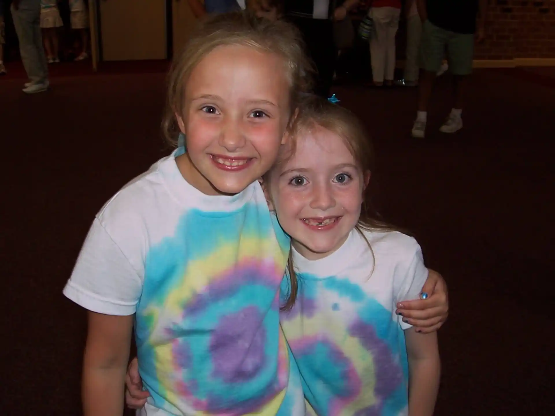 a couple of girls posing for the camera