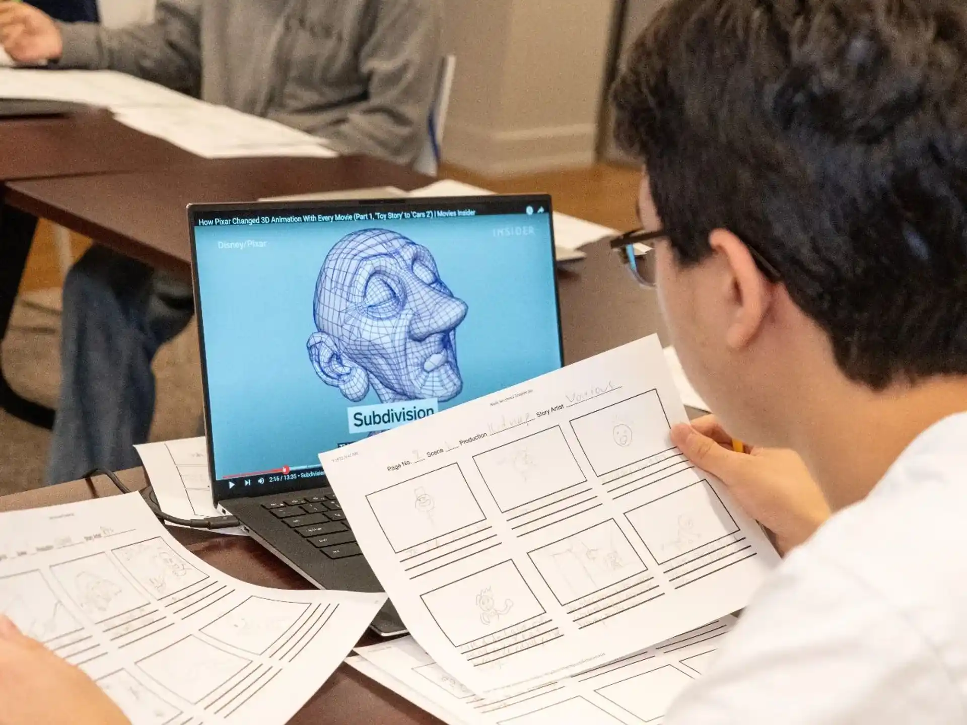 a man looking at a laptop
