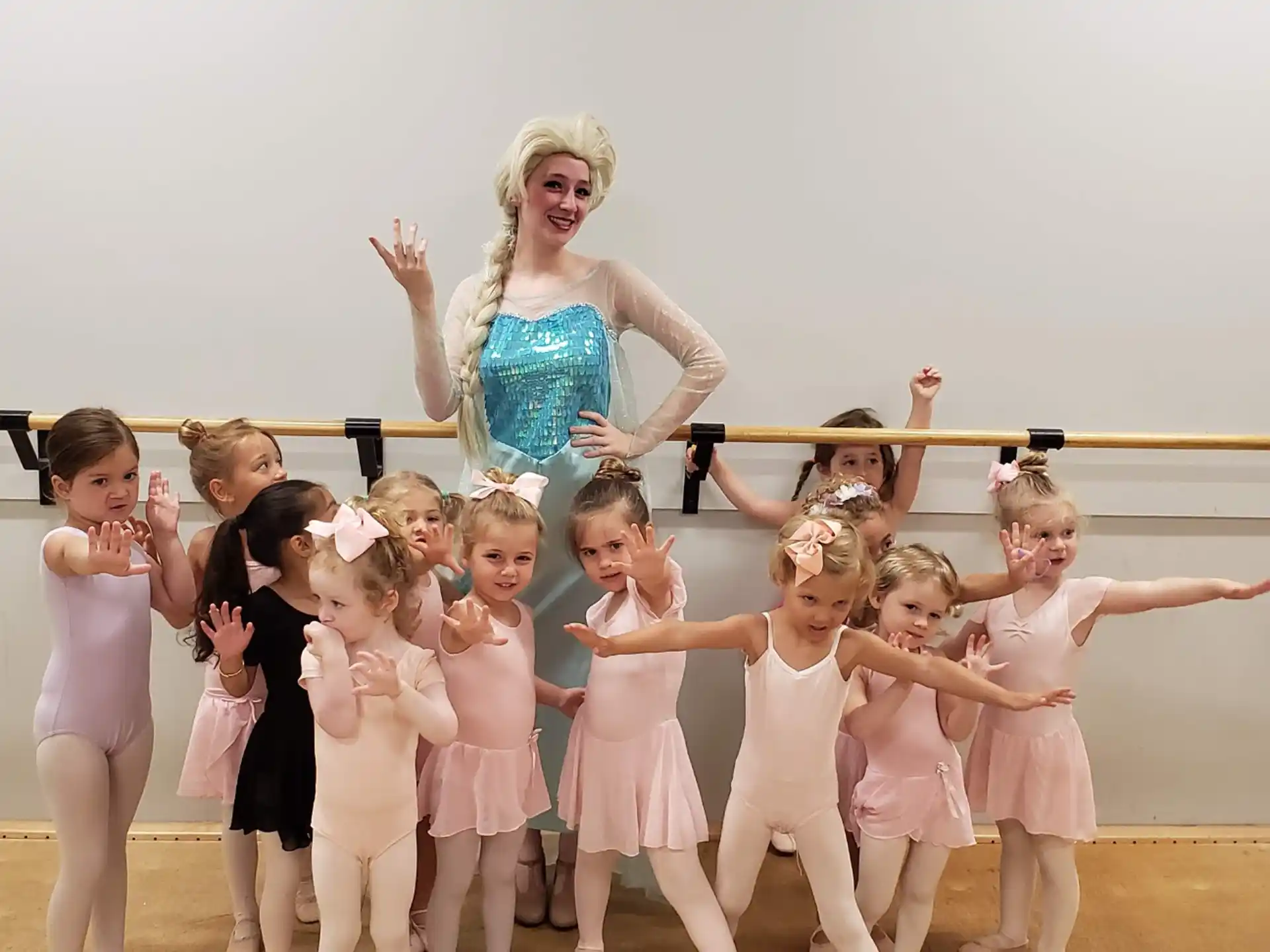 a person standing with a group of children