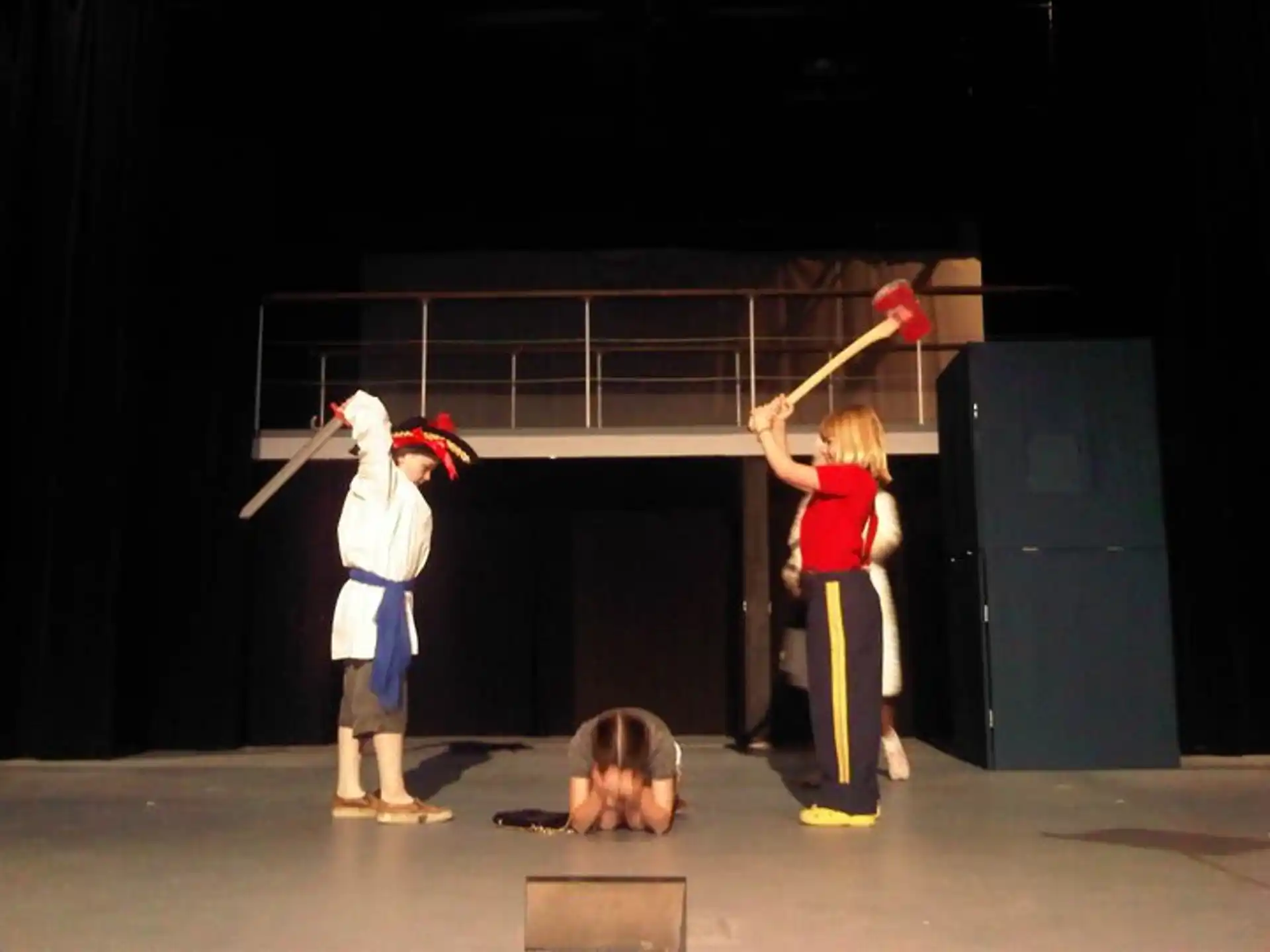 a group of people in clothing on a stage