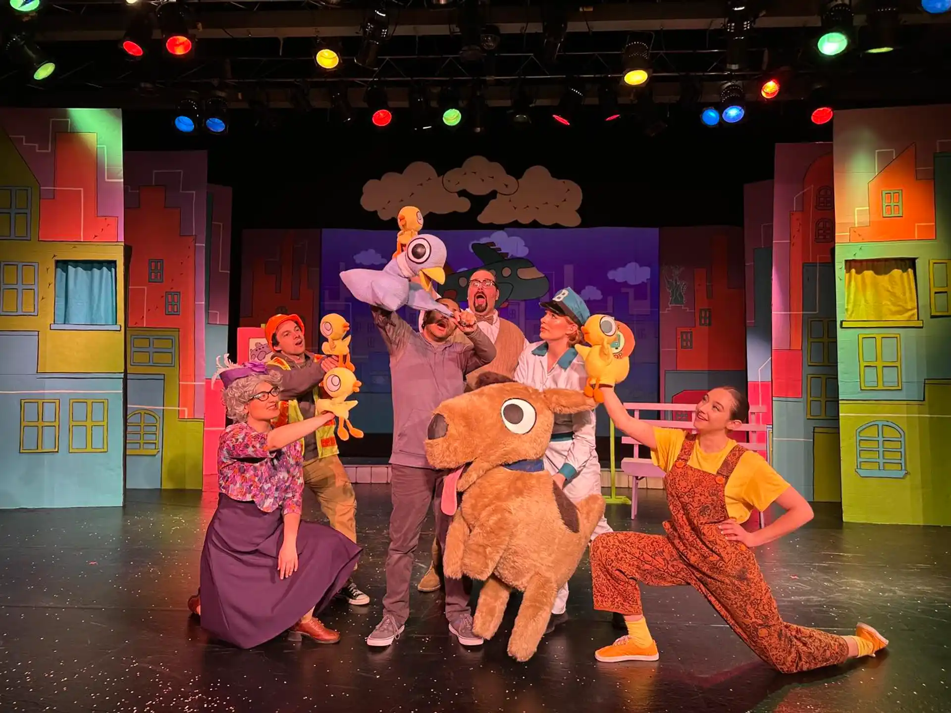 a group of people dressed up in clothing on a stage