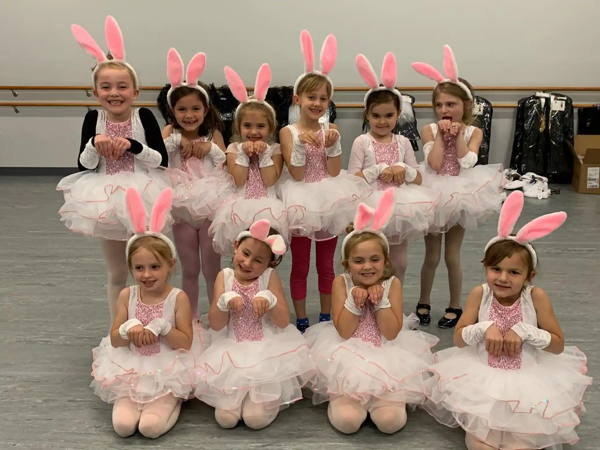 a group of girls wearing bunny ears and posing for a photo