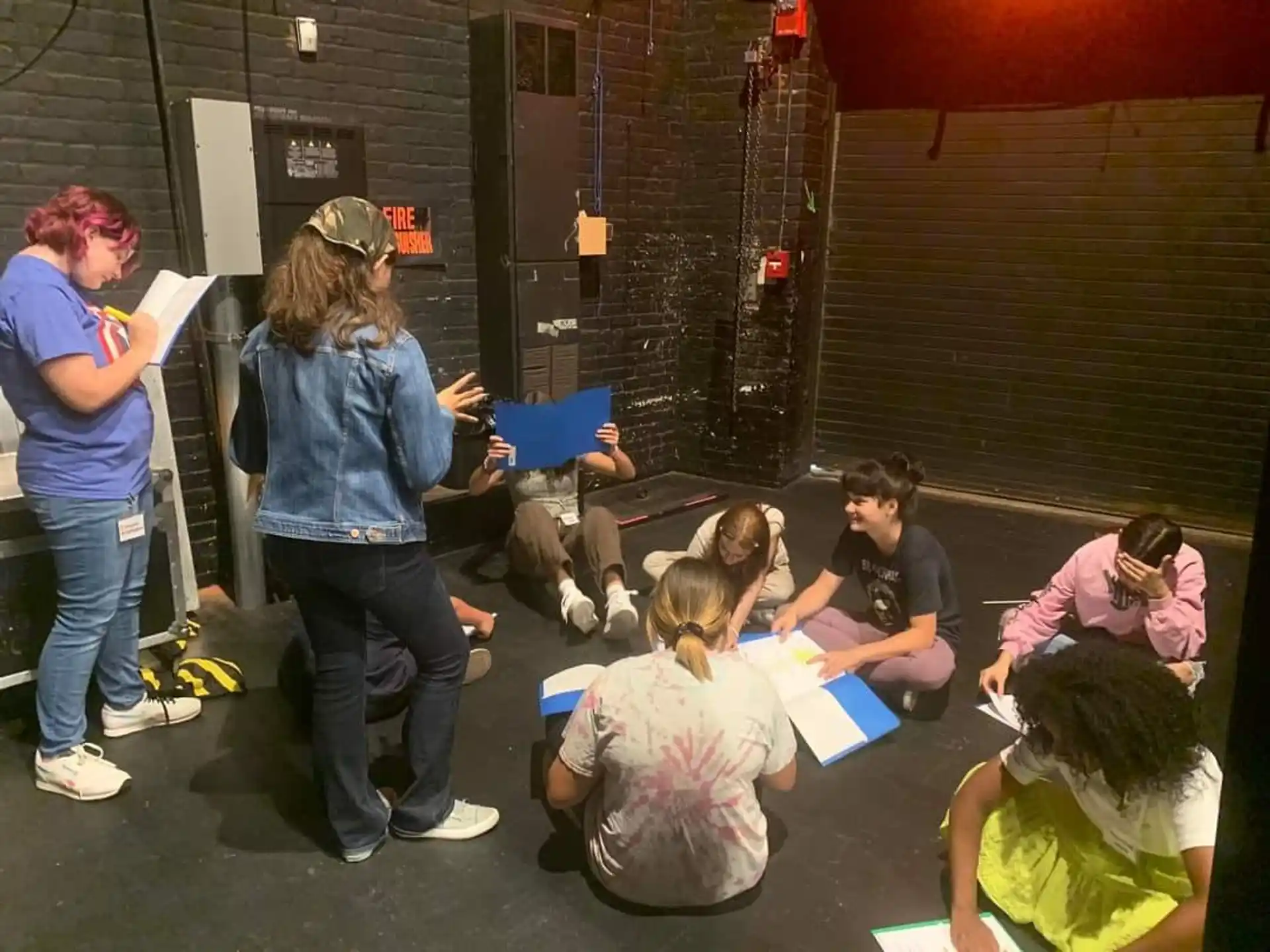 a group of people sitting on the floor