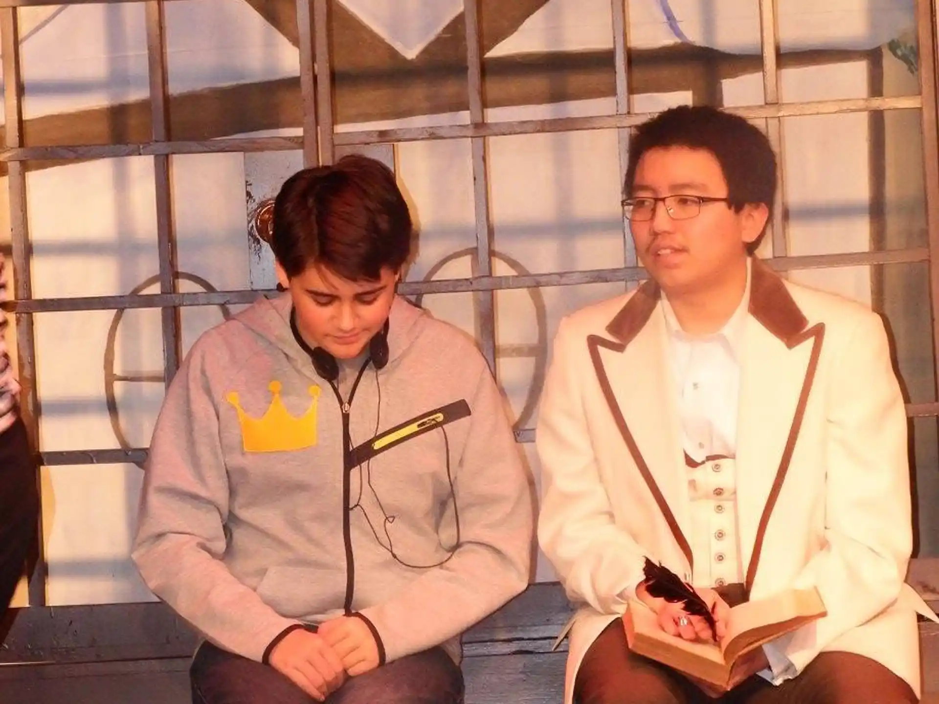 a couple of men sitting on a bench