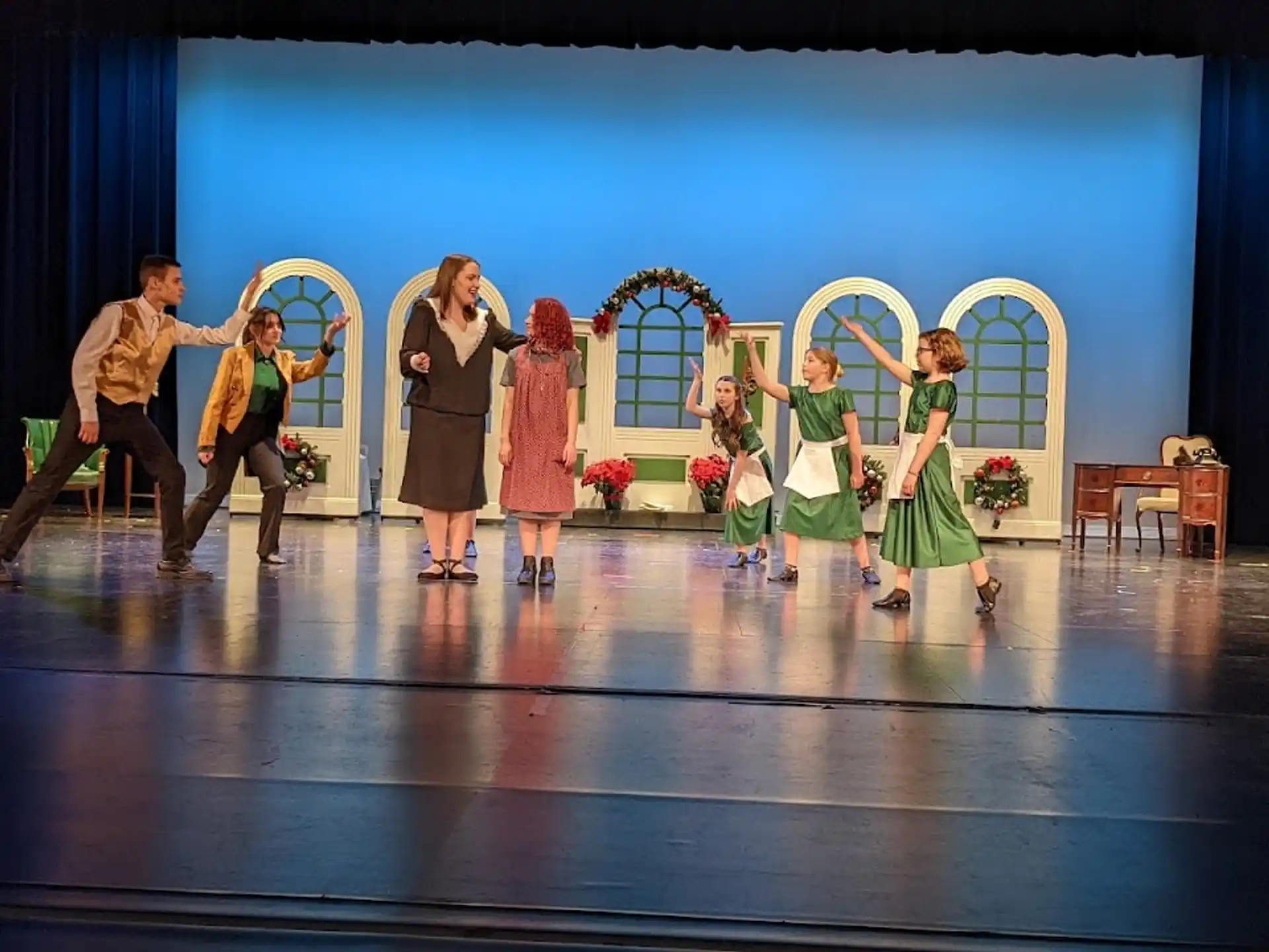 a group of people dancing on a stage