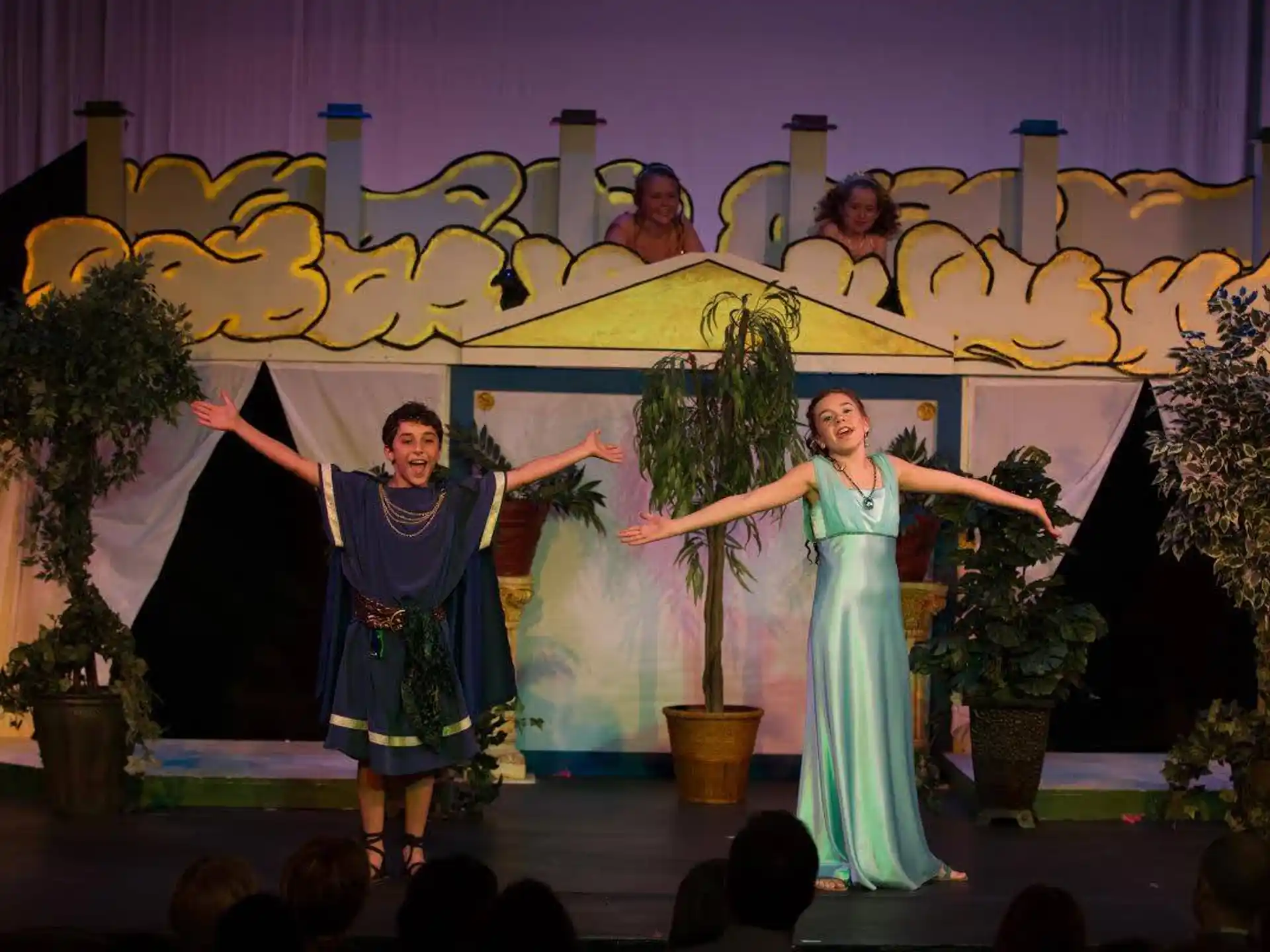 a group of women dancing on a stage